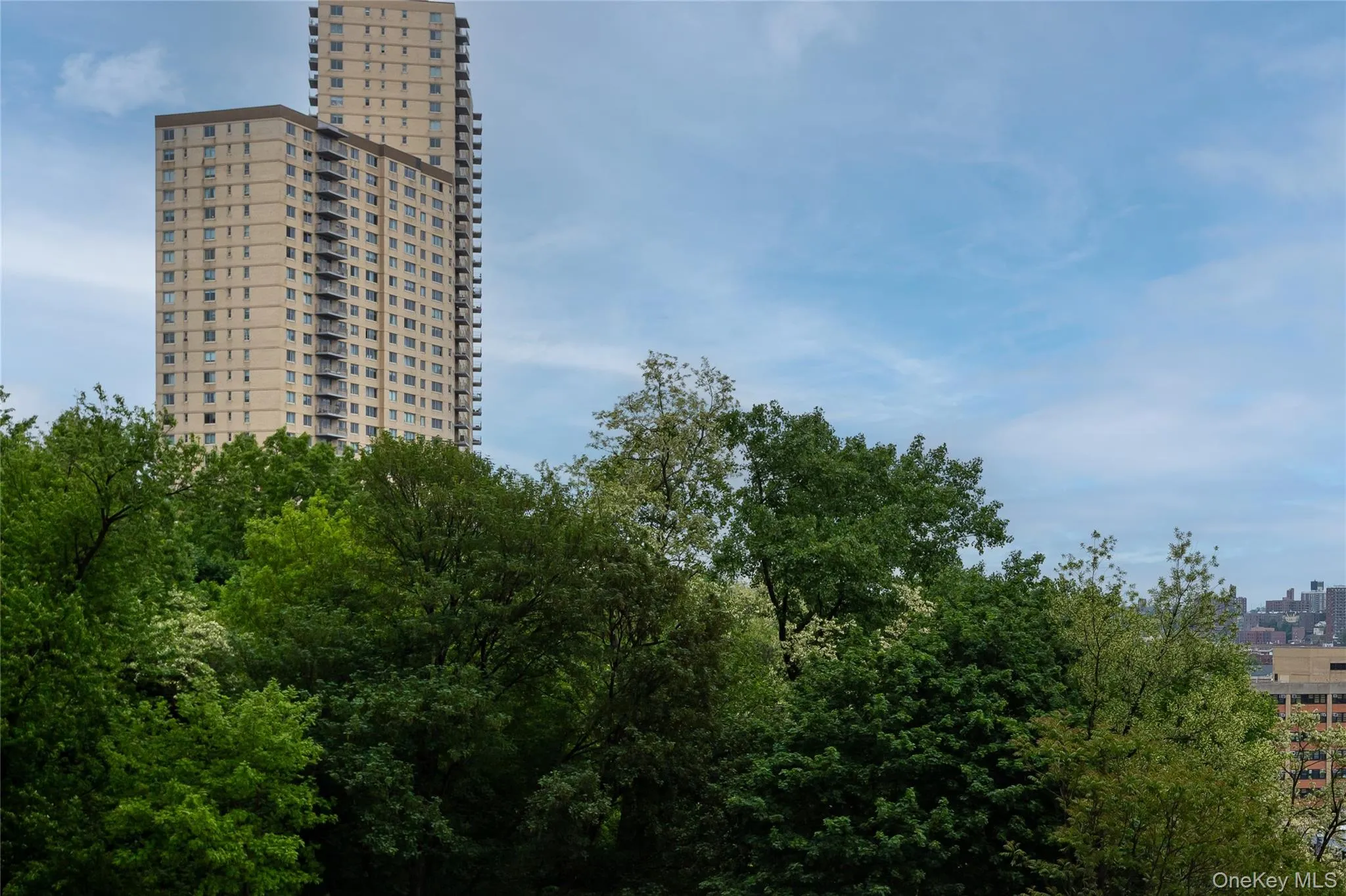View of building exterior featuring a city view View of building exterior featuring a city view