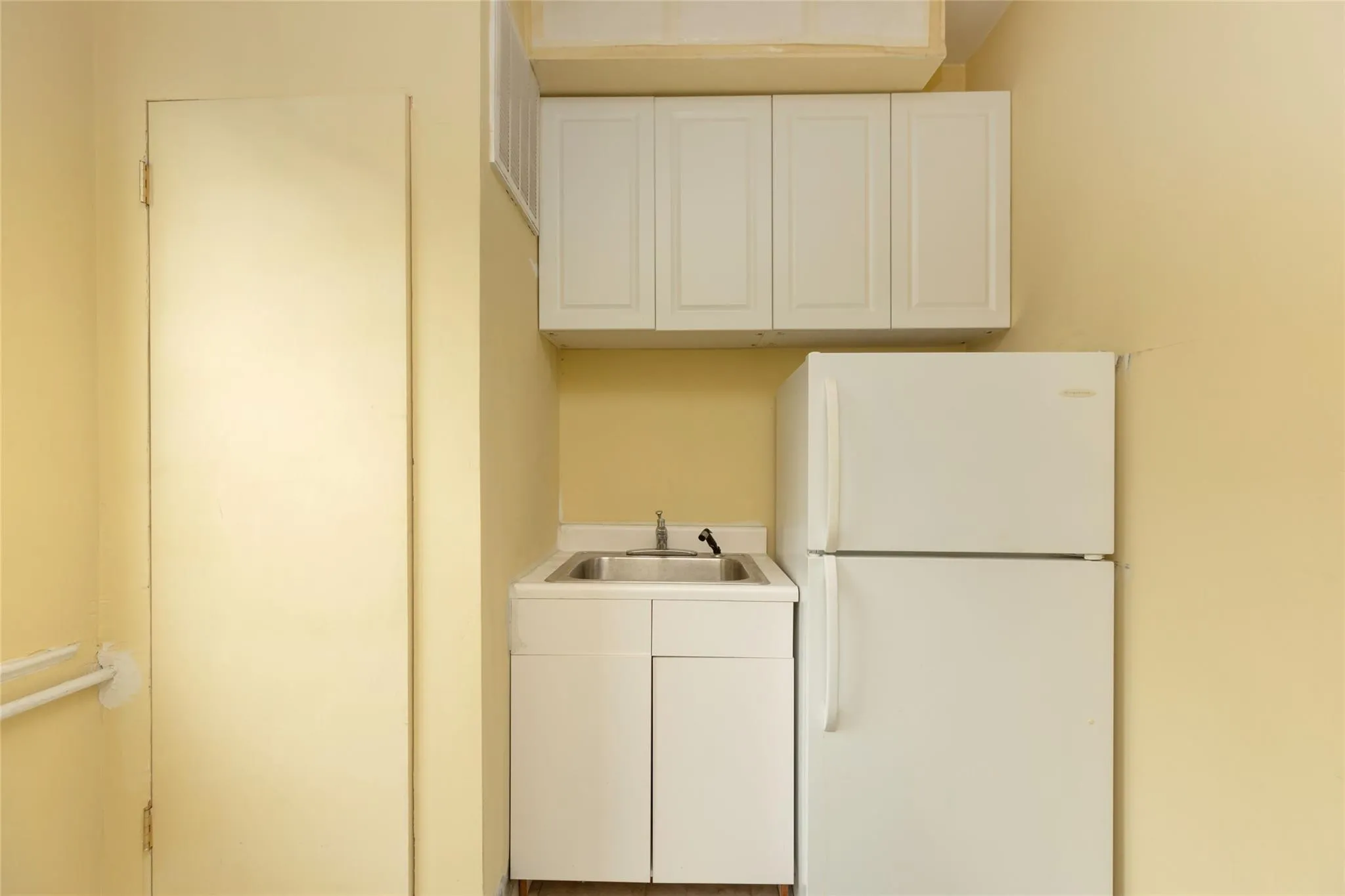 Laundry area featuring a sink Laundry area featuring a sink