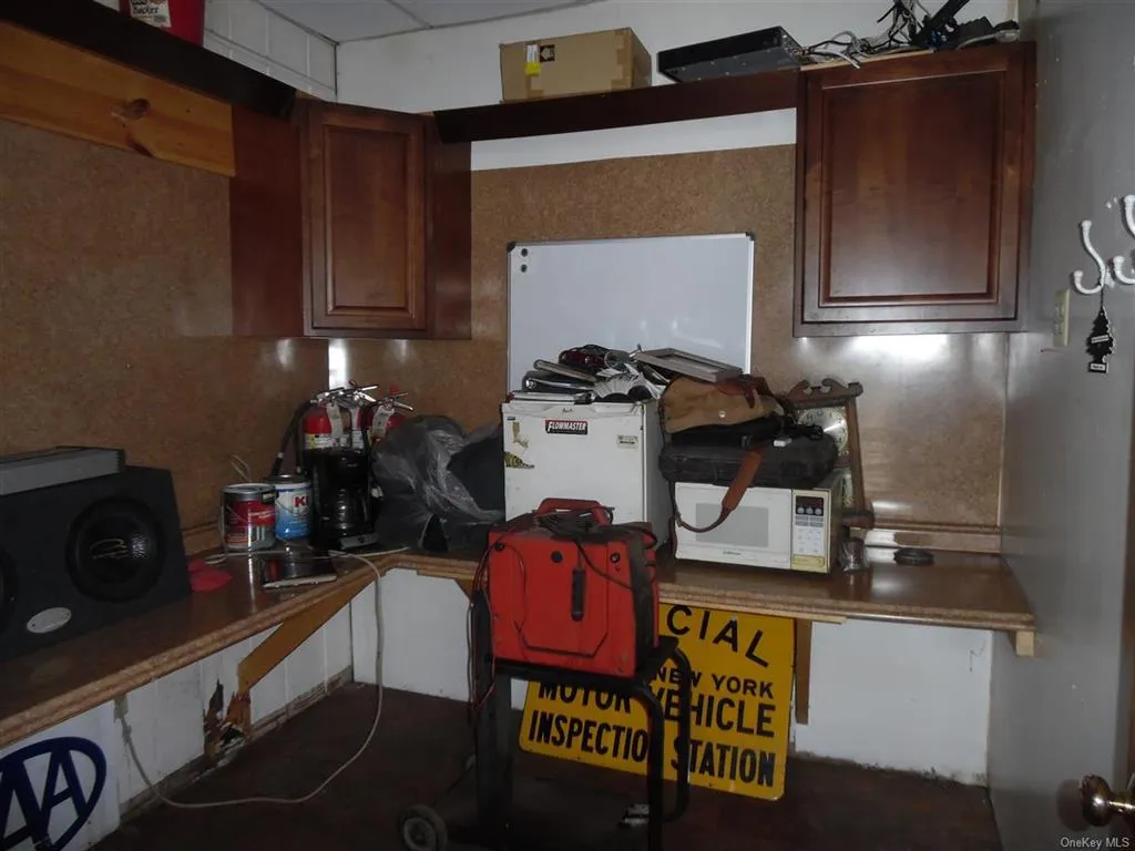 Kitchen with white microwave and tasteful backsplash Kitchen with white microwave and tasteful backsplash