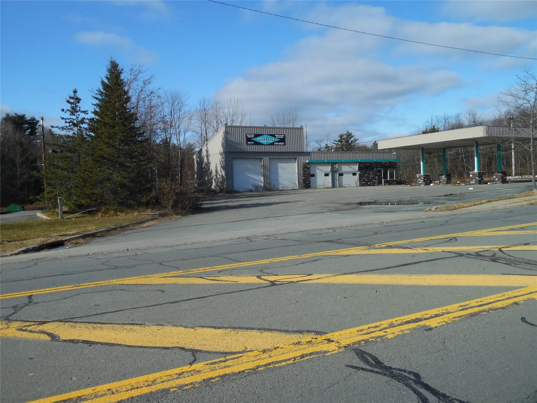 View of asphalt street featuring curbs View of asphalt street featuring curbs