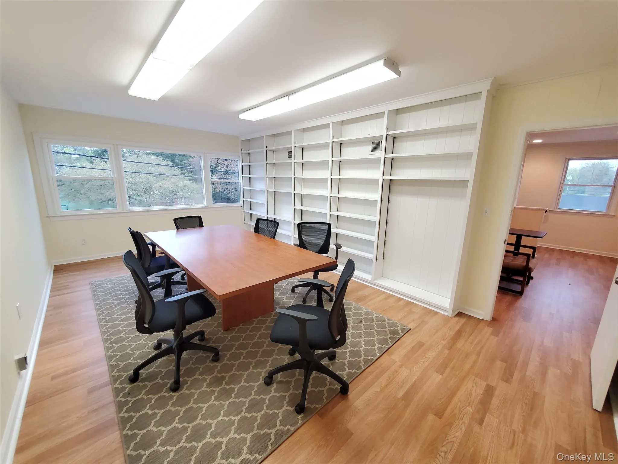 Office with light wood-style floors and baseboards Office with light wood-style floors and baseboards