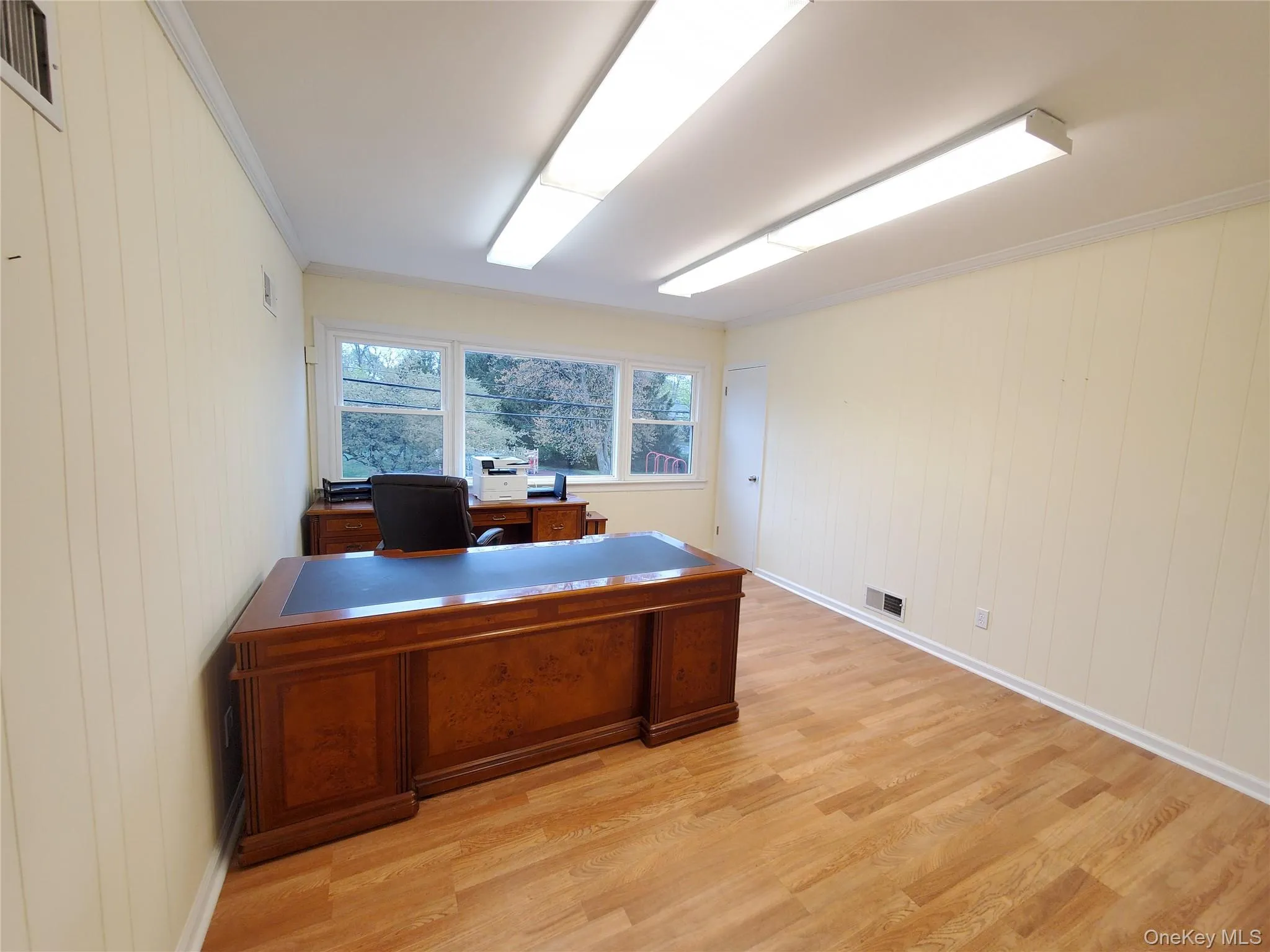 Private Office featuring wood finished floors, recessed lighting, and baseboards Private Office featuring wood finished floors, recessed lighting, and baseboards