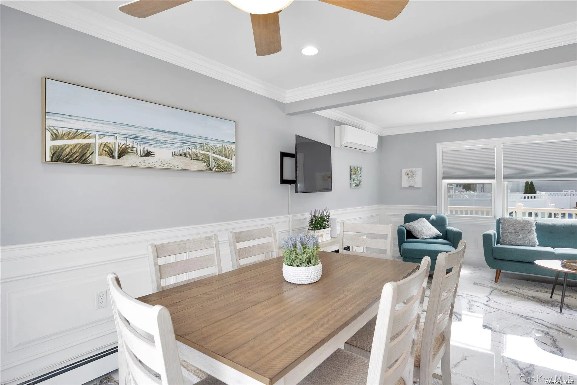 Dining area with an AC wall unit, marble tiled flooring, wainscoting, a baseboard heating unit, and recessed lighting Dining area with an AC wall unit, marble tiled flooring, wainscoting, a baseboard heating unit, and recessed lighting