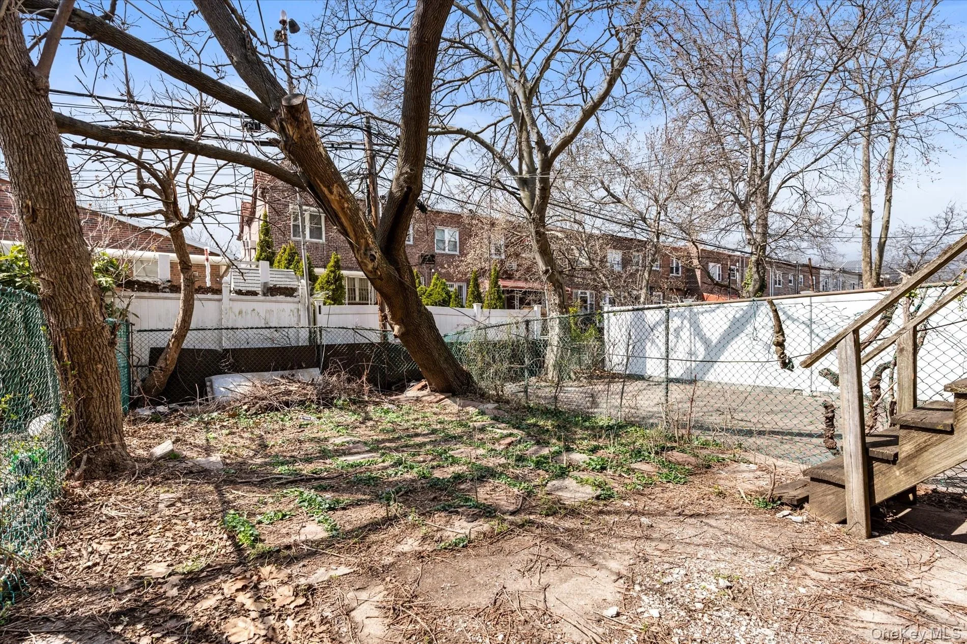 View of yard with fence and a residential view View of yard with fence and a residential view