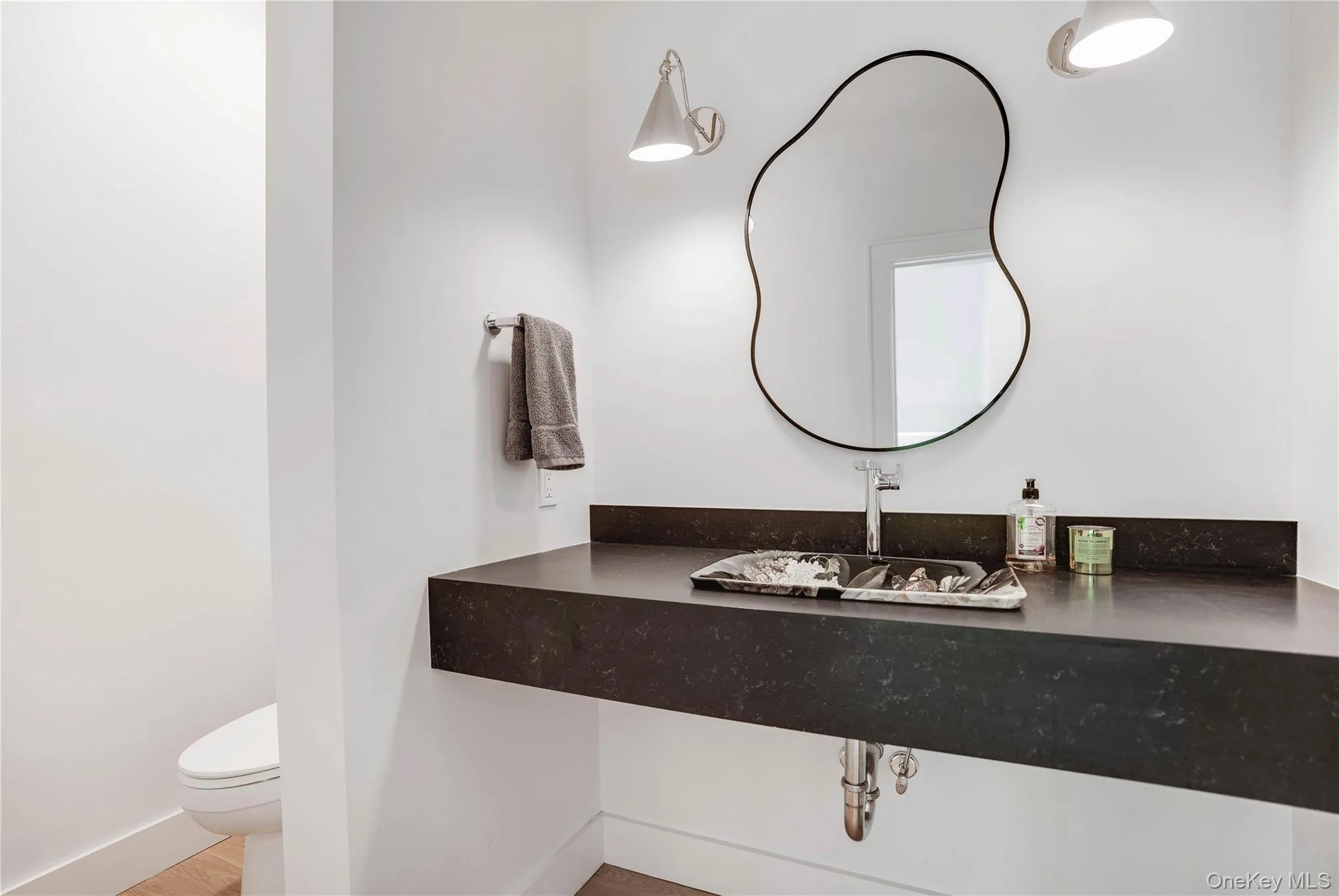 Bathroom with toilet and vanity Bathroom with toilet and vanity