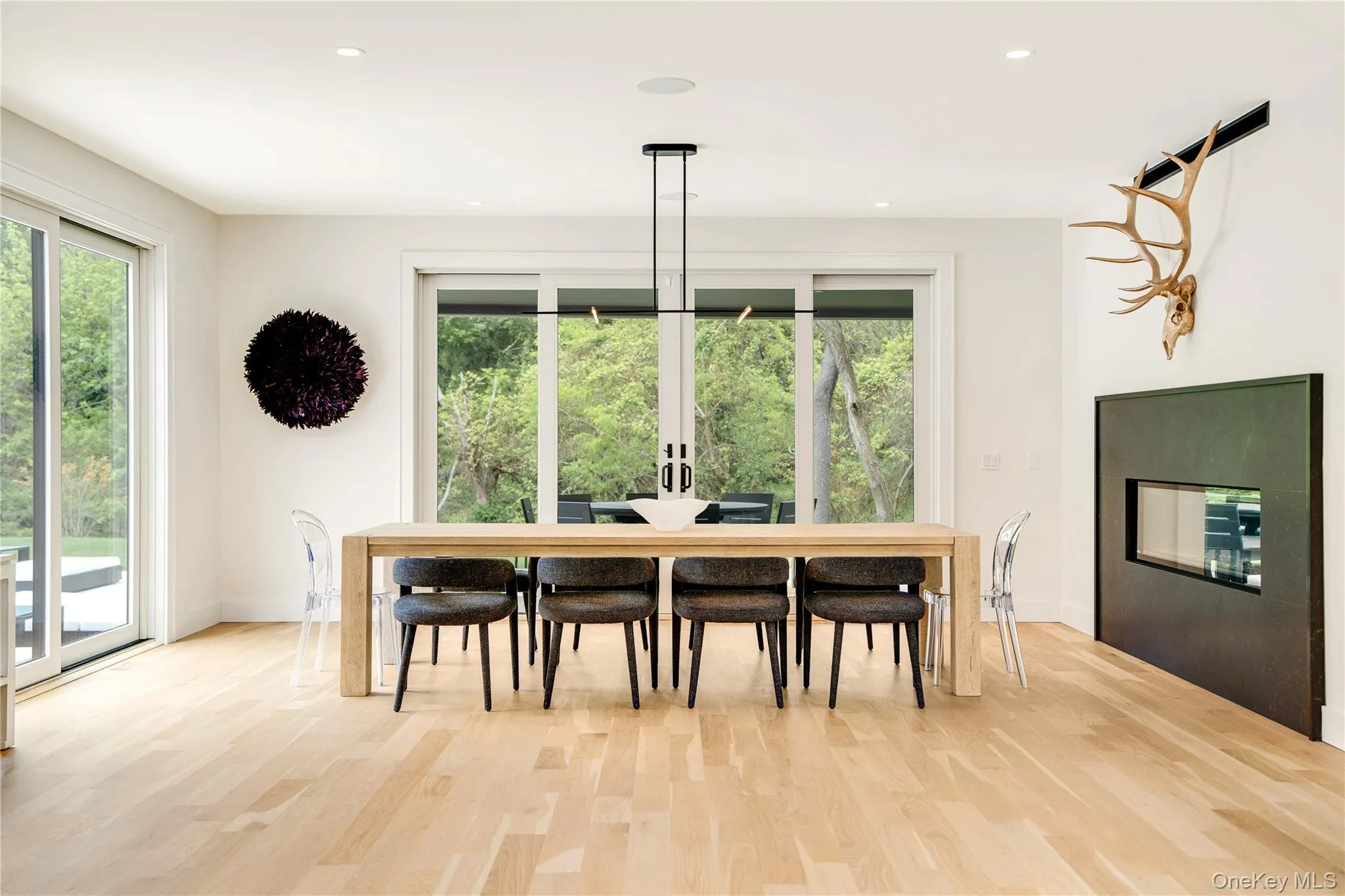 Dining area with plenty of natural light, light wood-style flooring, baseboards, and recessed lighting Dining area with plenty of natural light, light wood-style flooring, baseboards, and recessed lighting