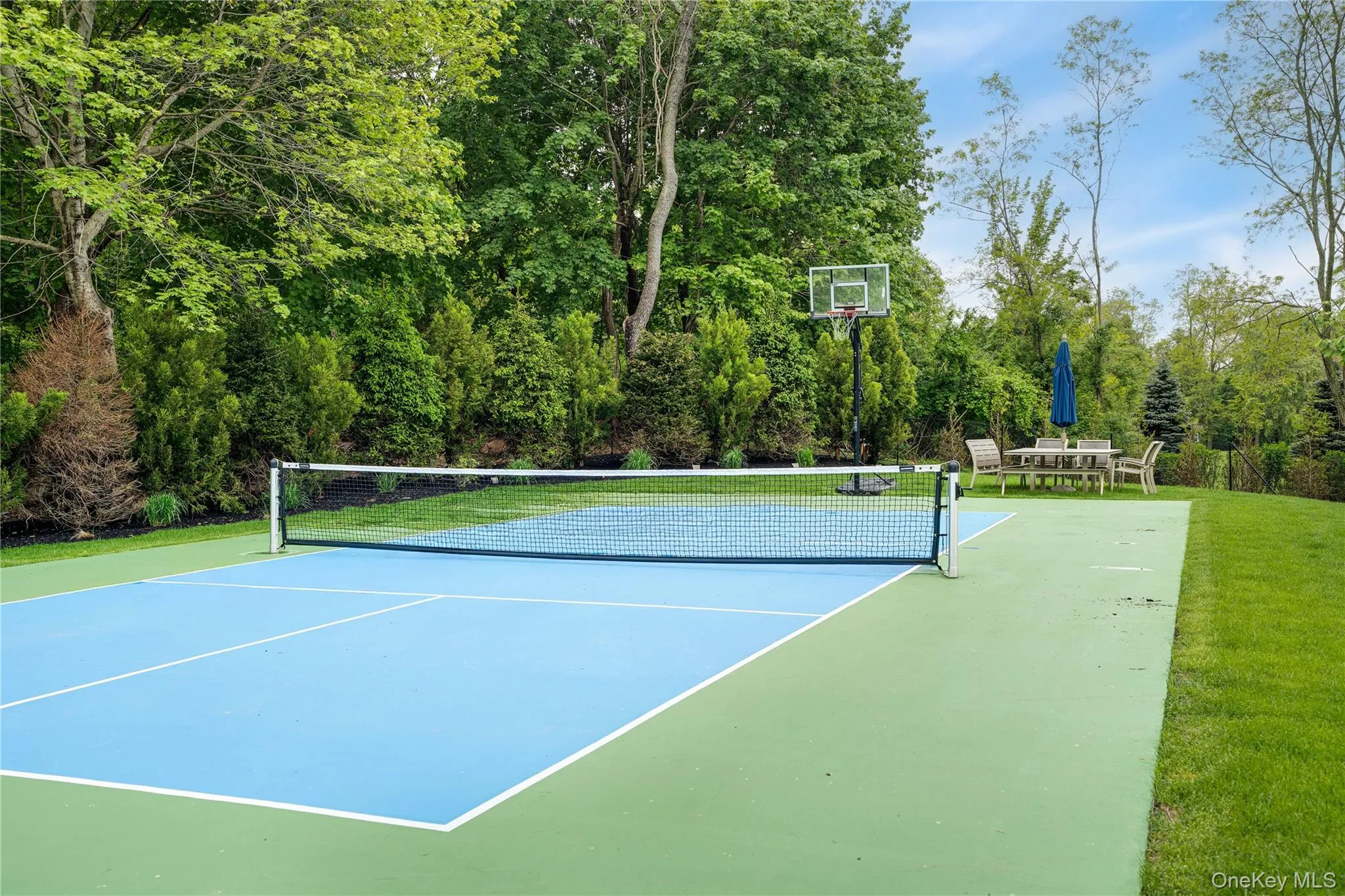 View of tennis court with community basketball court View of tennis court with community basketball court