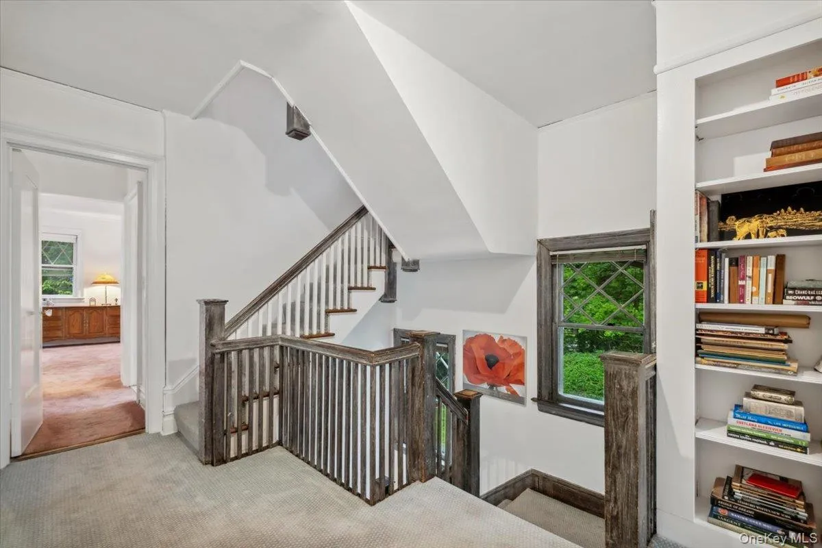 Staircase featuring carpet Staircase featuring carpet