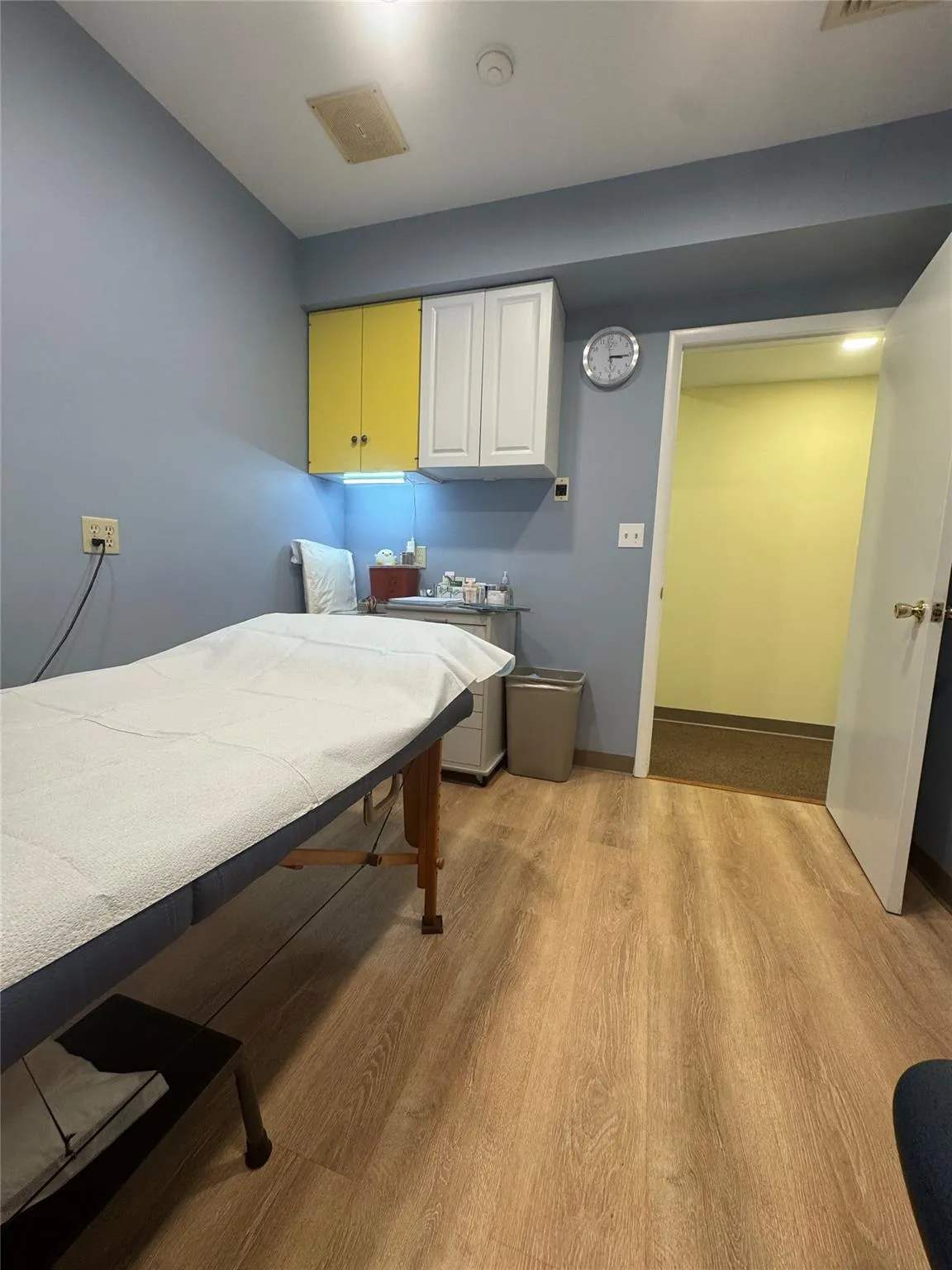 Bedroom with light wood-style flooring and baseboards Bedroom with light wood-style flooring and baseboards