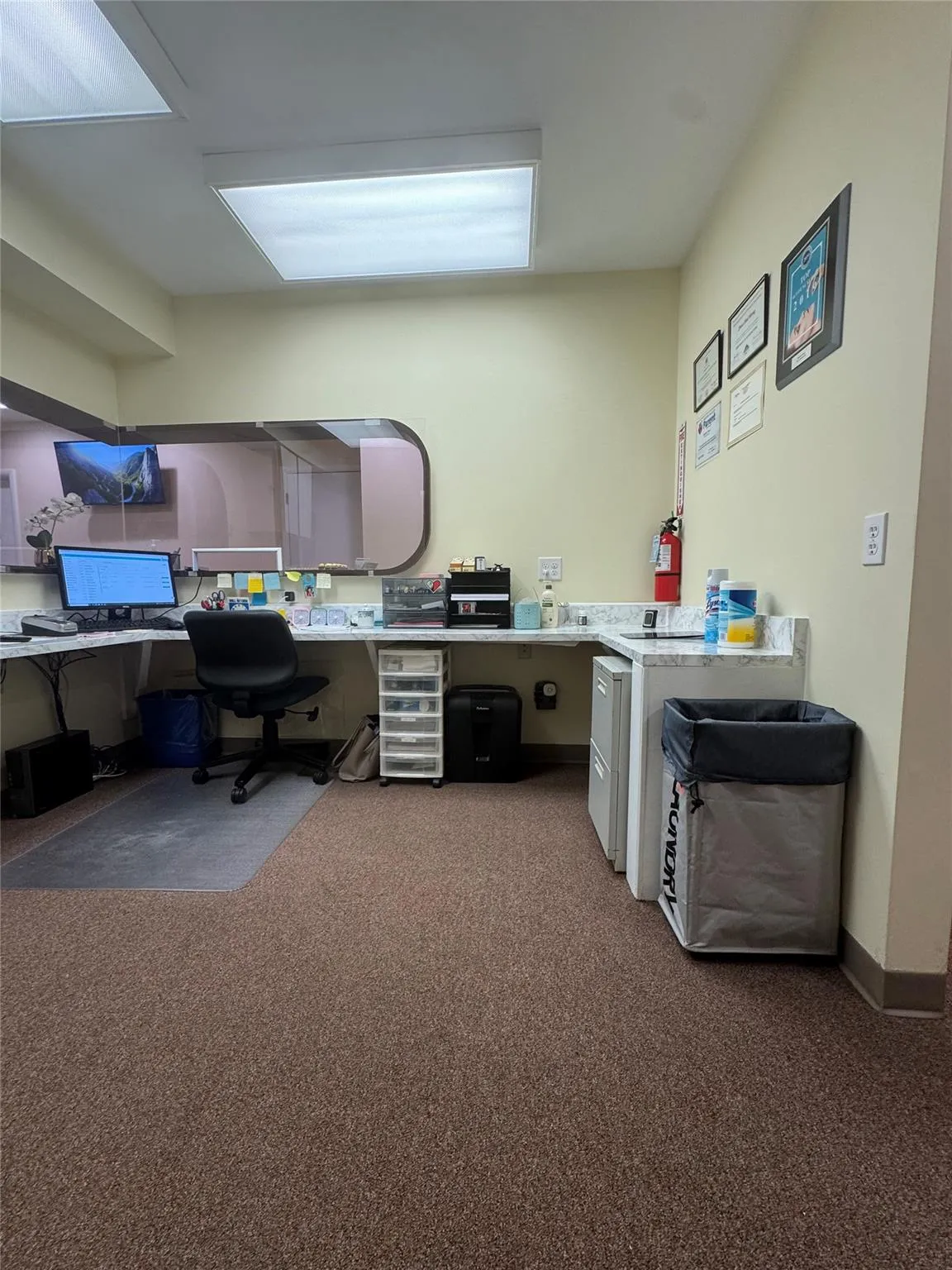 Carpeted office with built in desk Carpeted office with built in desk
