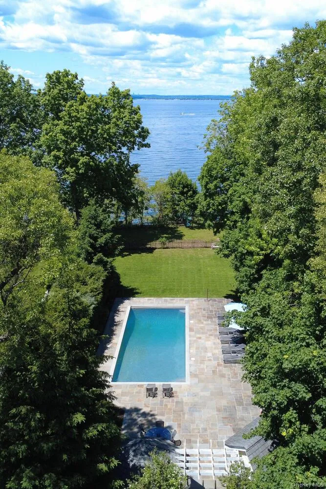 Aerial view of a large body of water and a pool Aerial view of a large body of water and a pool