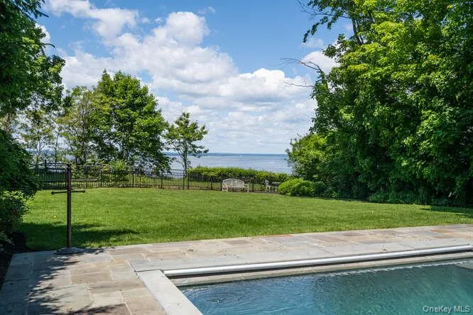 Outdoor pool with a patio area Outdoor pool with a patio area