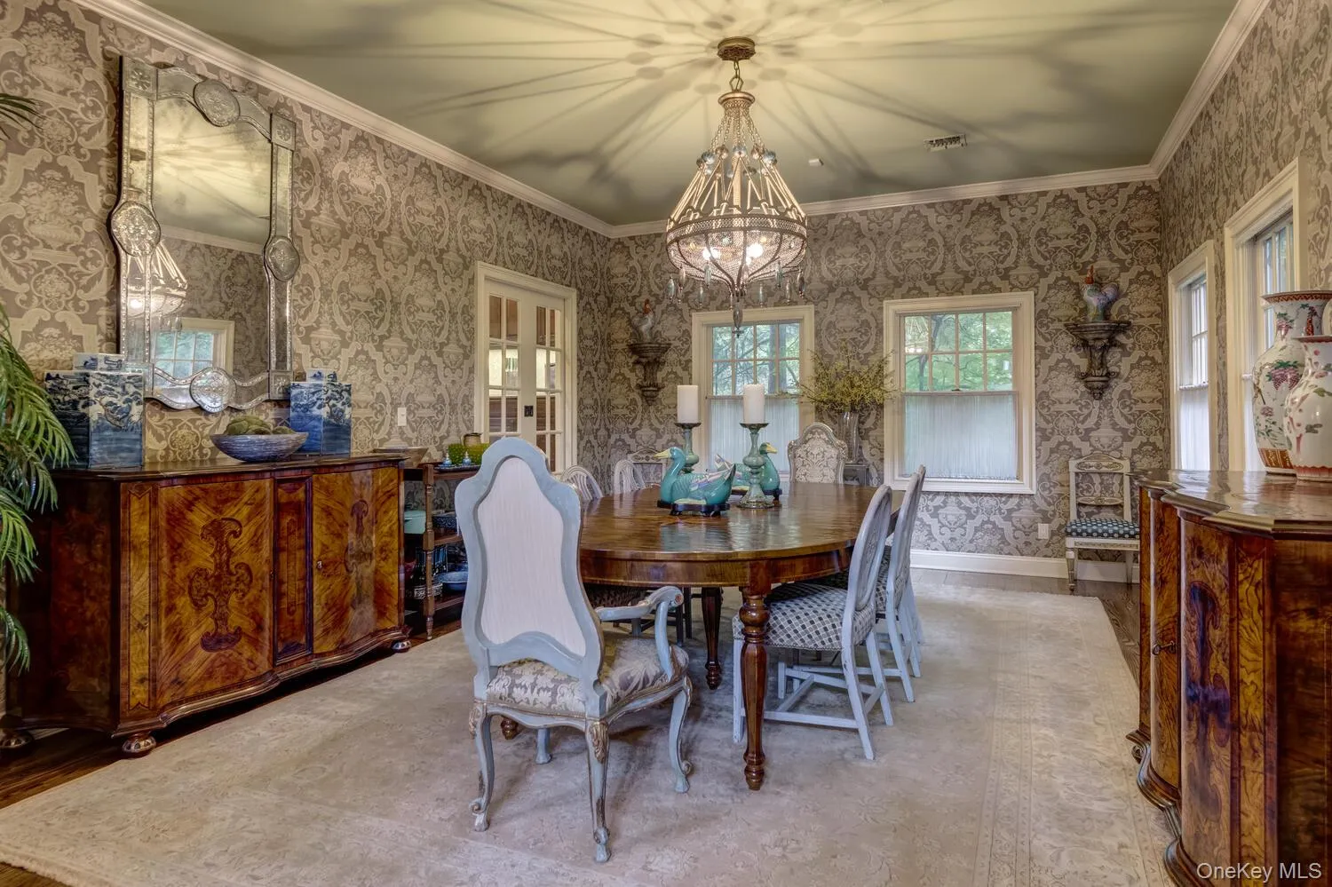 Dining room wiht high ceilings natural light and elevated crown molding Dining room wiht high ceilings natural light and elevated crown molding