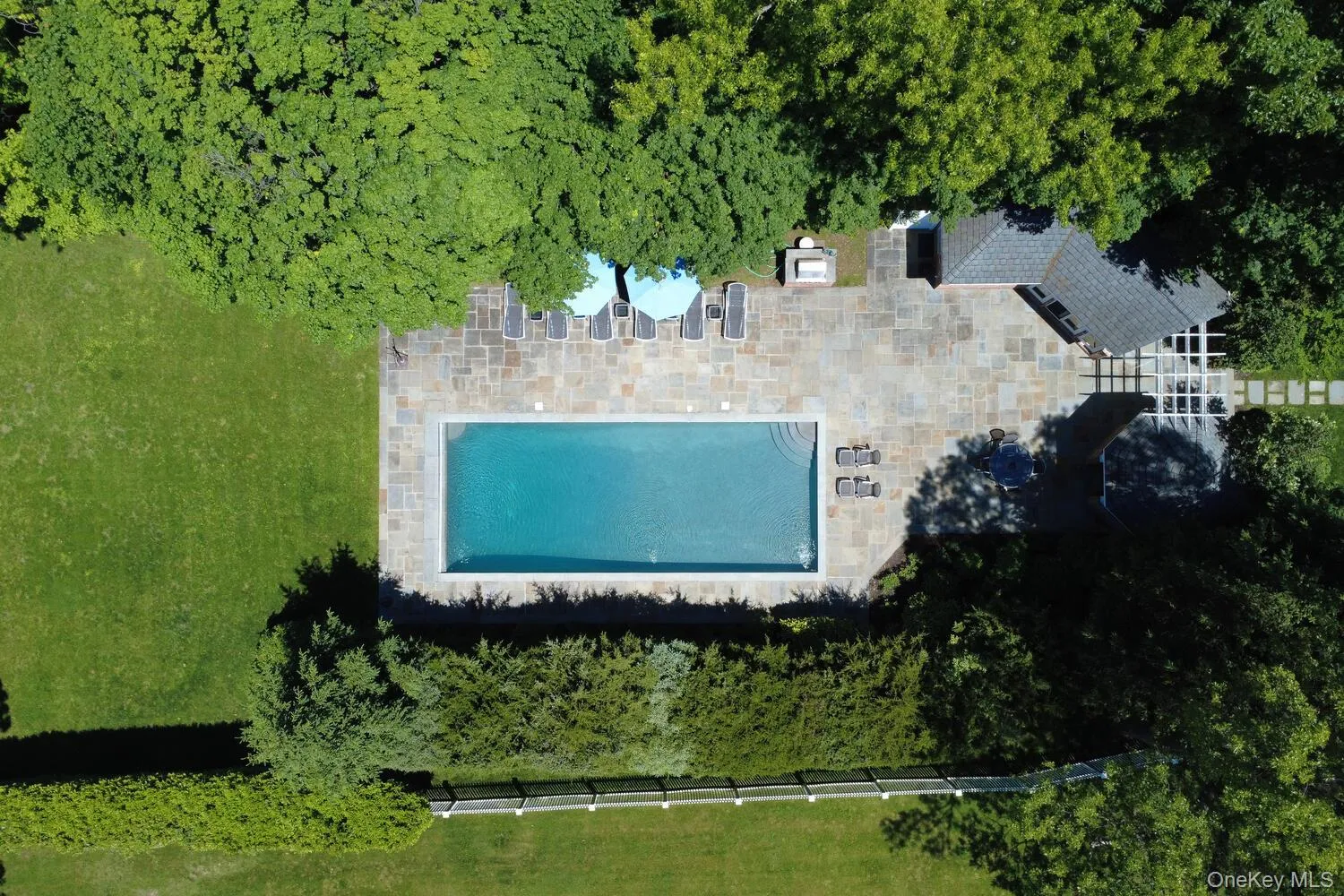 View of subject property featuring a pool area View of subject property featuring a pool area