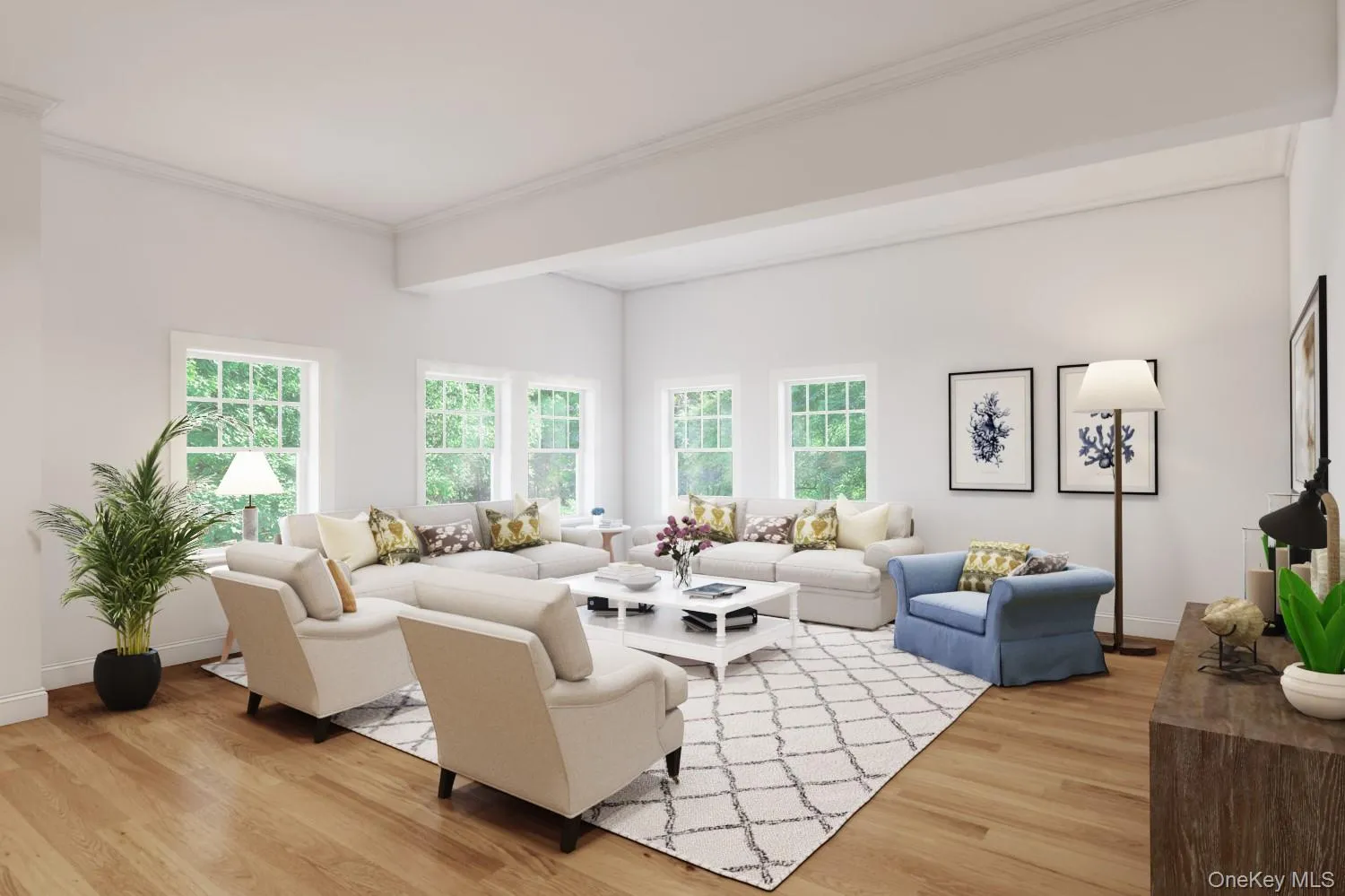Living area with light wood-style flooring and ornamental molding Living area with light wood-style flooring and ornamental molding