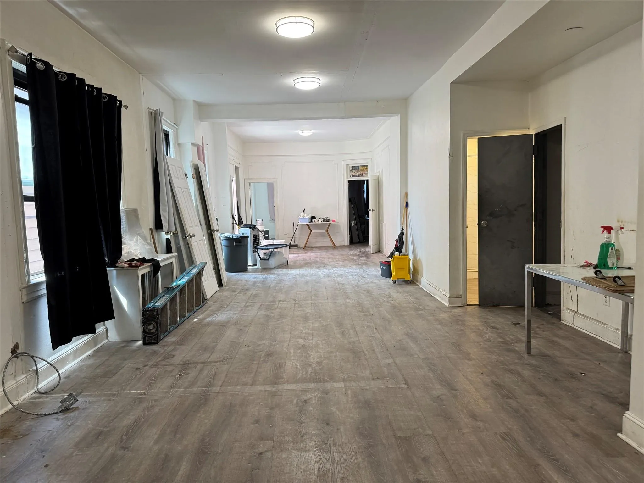 Corridor featuring wood finished floors Corridor featuring wood finished floors