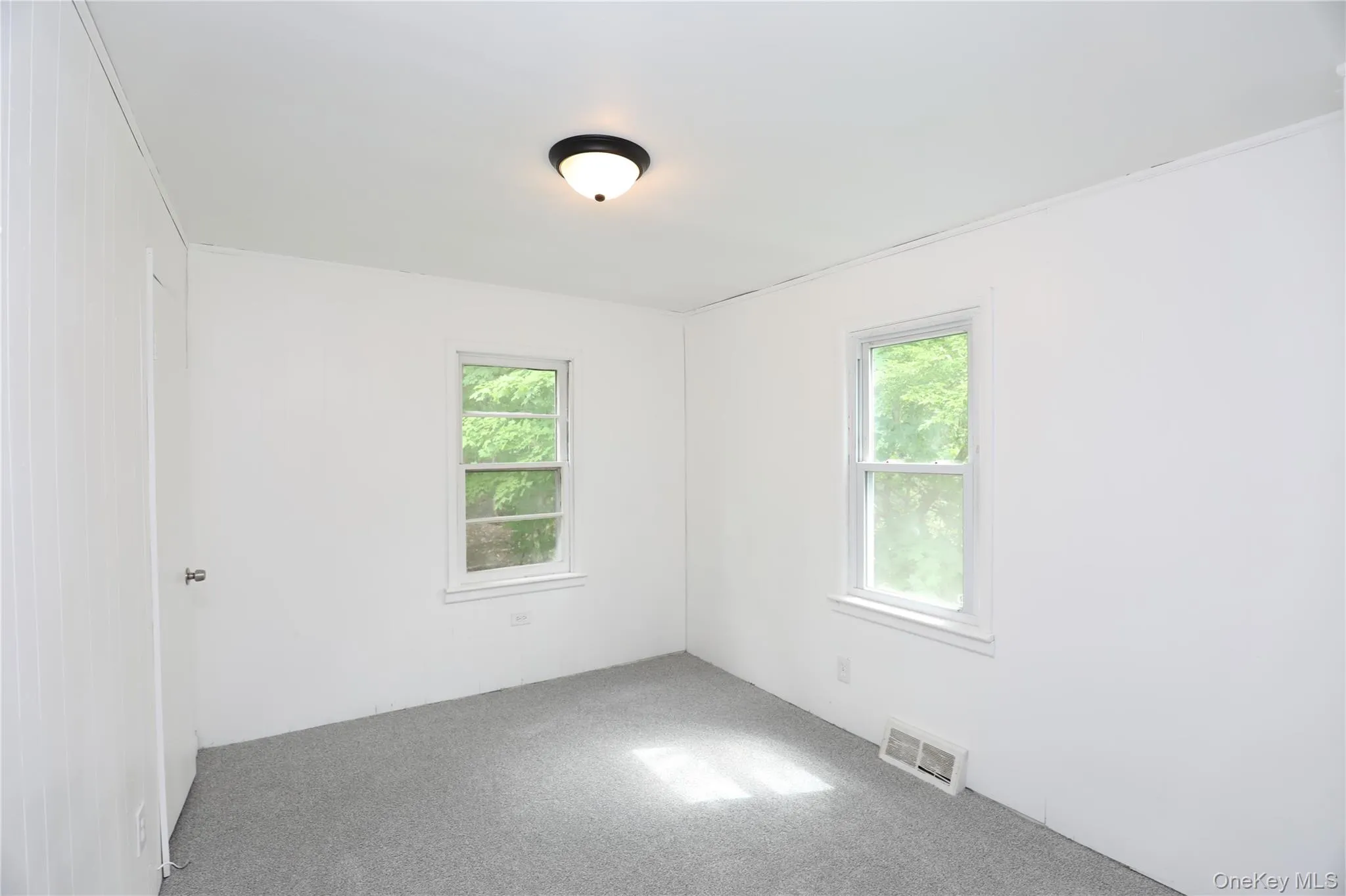 Unfurnished room featuring carpet floors Unfurnished room featuring carpet floors