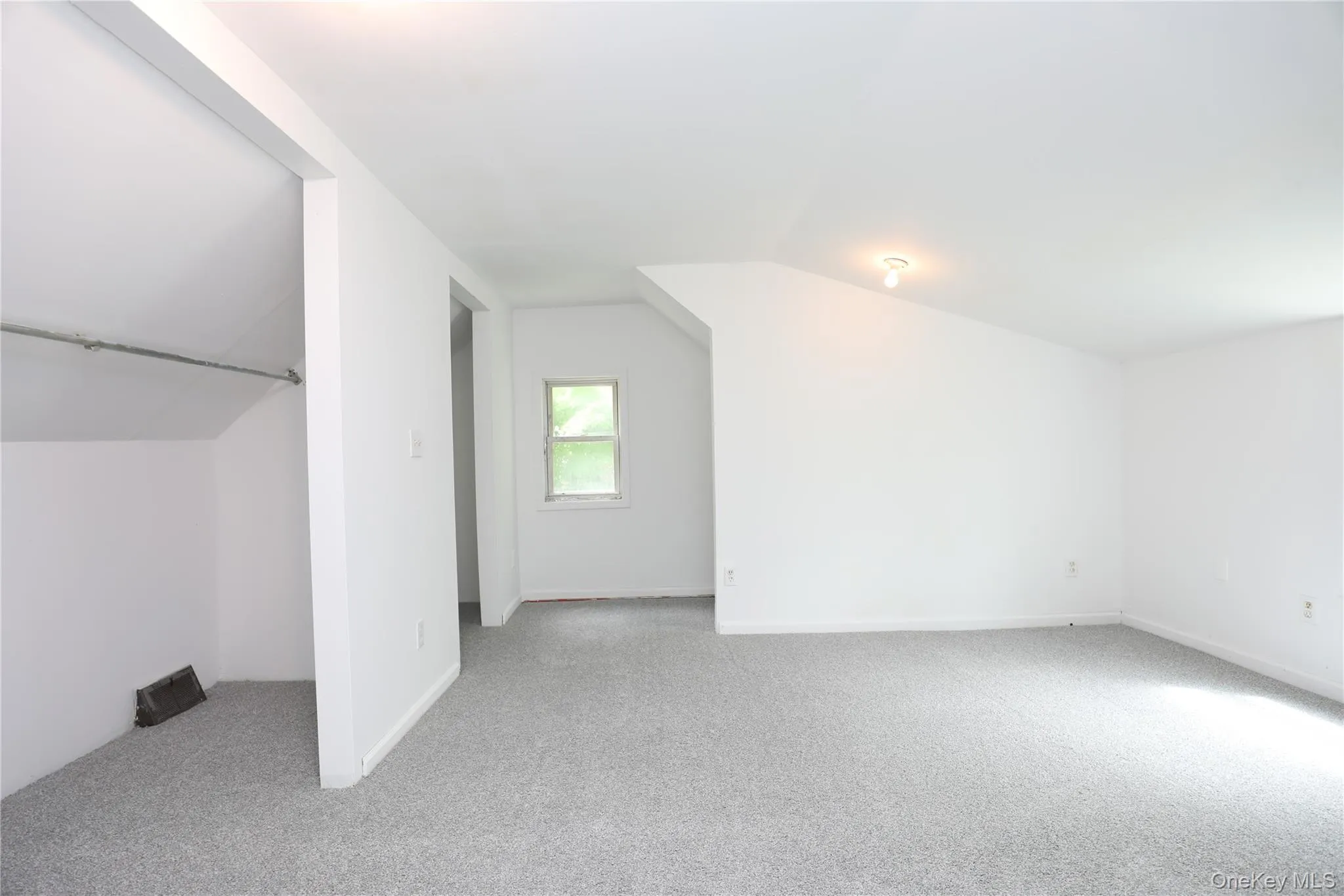 Bonus room with carpet, lofted ceiling, and baseboards Bonus room with carpet, lofted ceiling, and baseboards