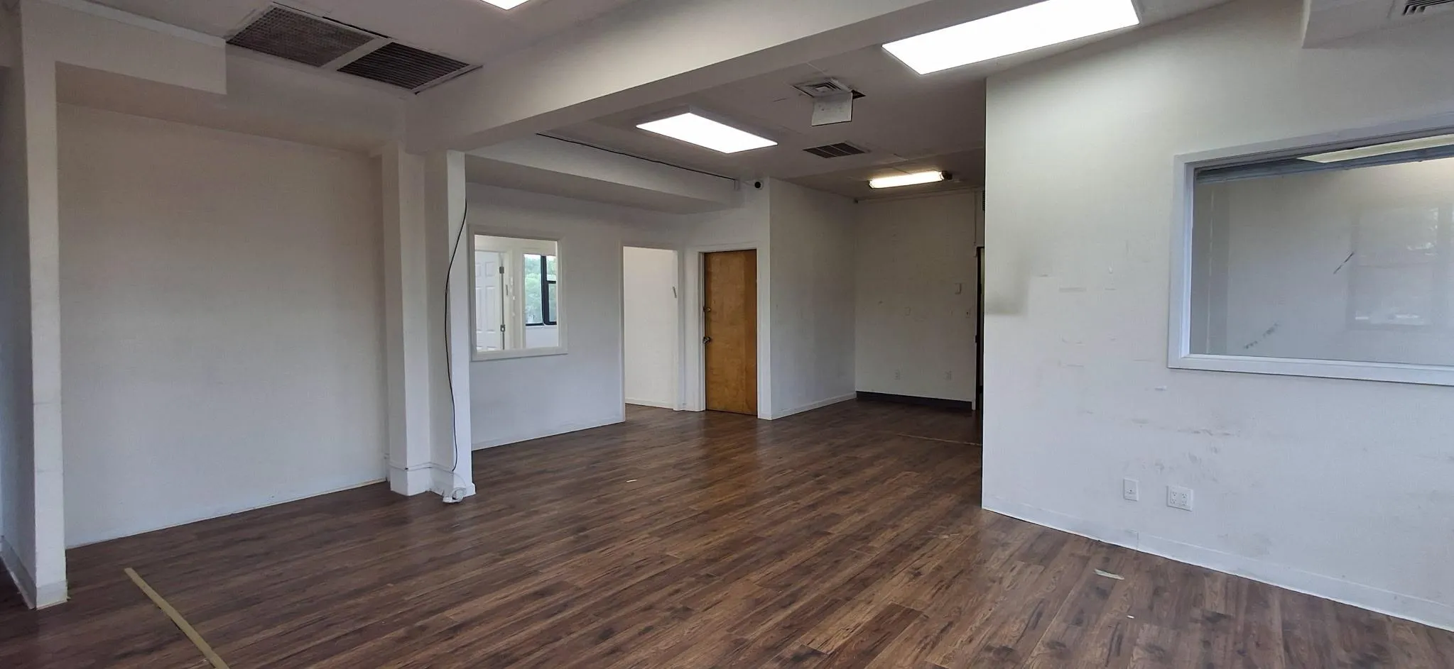 Spare room featuring dark wood finished floors Spare room featuring dark wood finished floors
