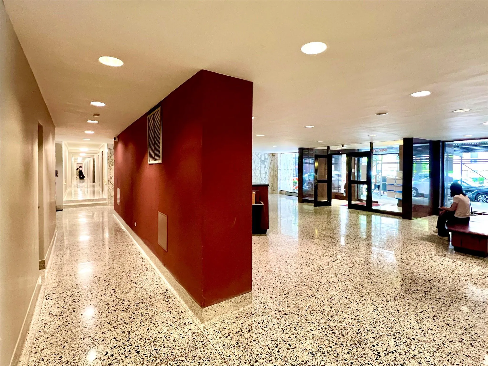 Building lobby featuring recessed lighting and expansive windows Building lobby featuring recessed lighting and expansive windows