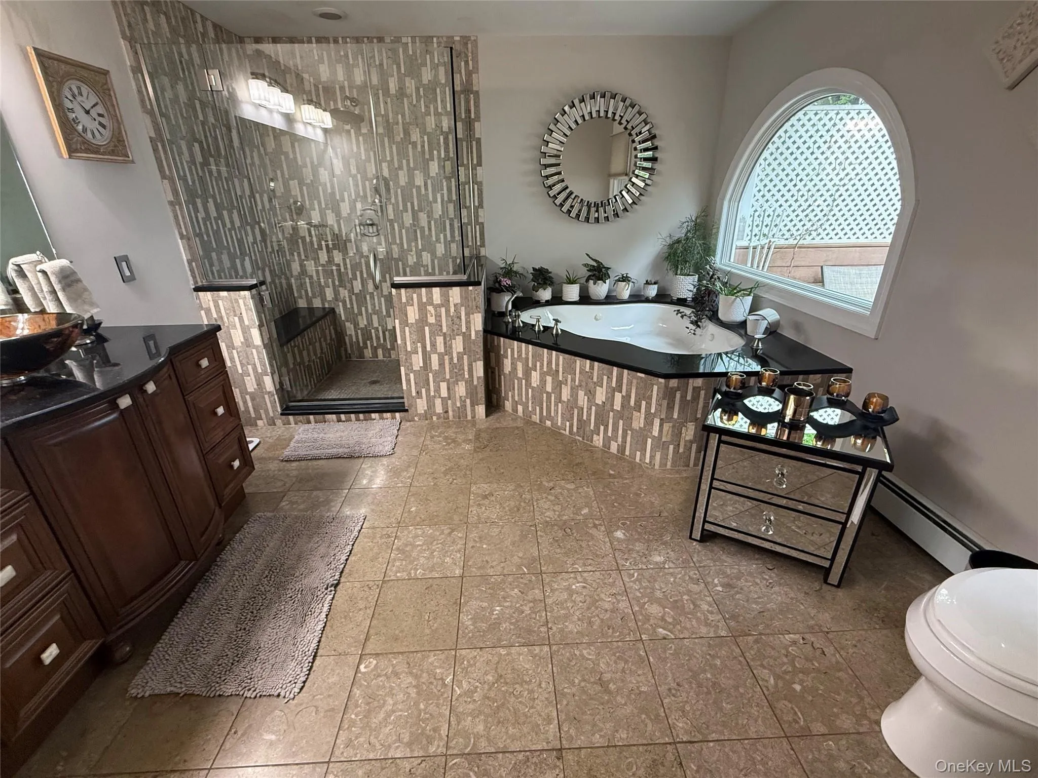 Bathroom featuring a bath, a tile shower, vanity, tile patterned flooring, and toilet Bathroom featuring a bath, a tile shower, vanity, tile patterned flooring, and toilet