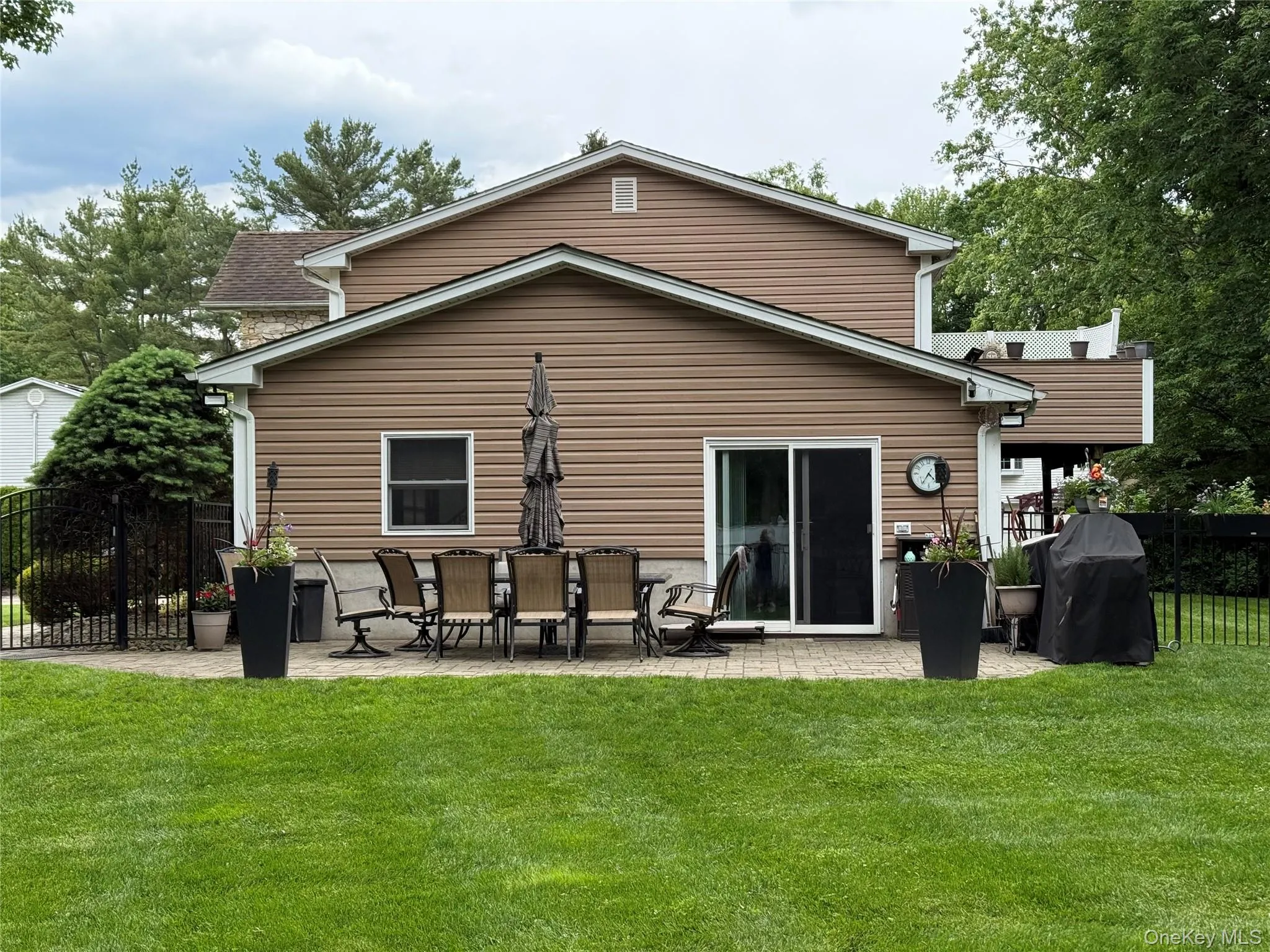 Back of property with a patio area Back of property with a patio area