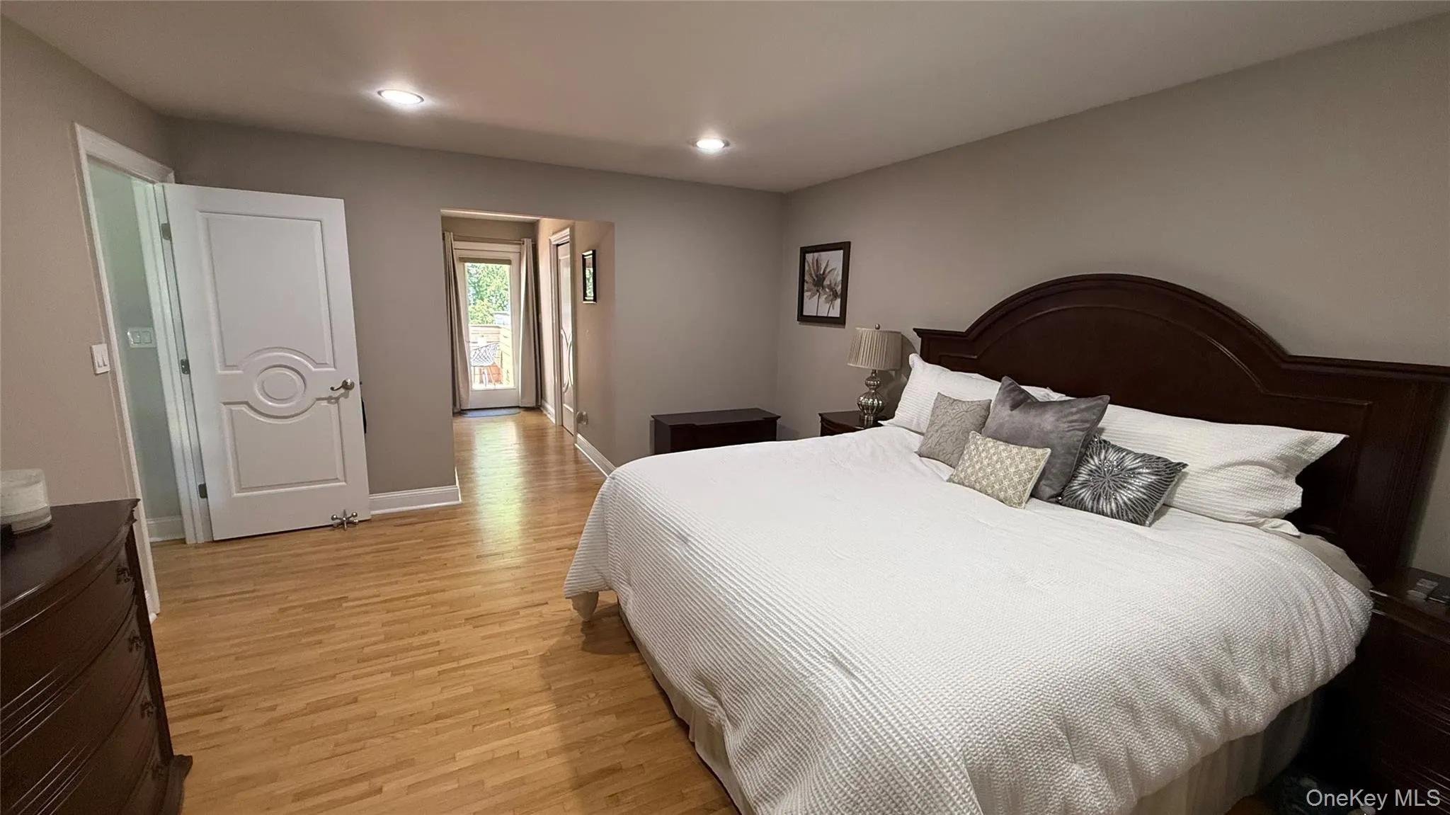 Bedroom with light wood-style floors, recessed lighting, and baseboards Bedroom with light wood-style floors, recessed lighting, and baseboards