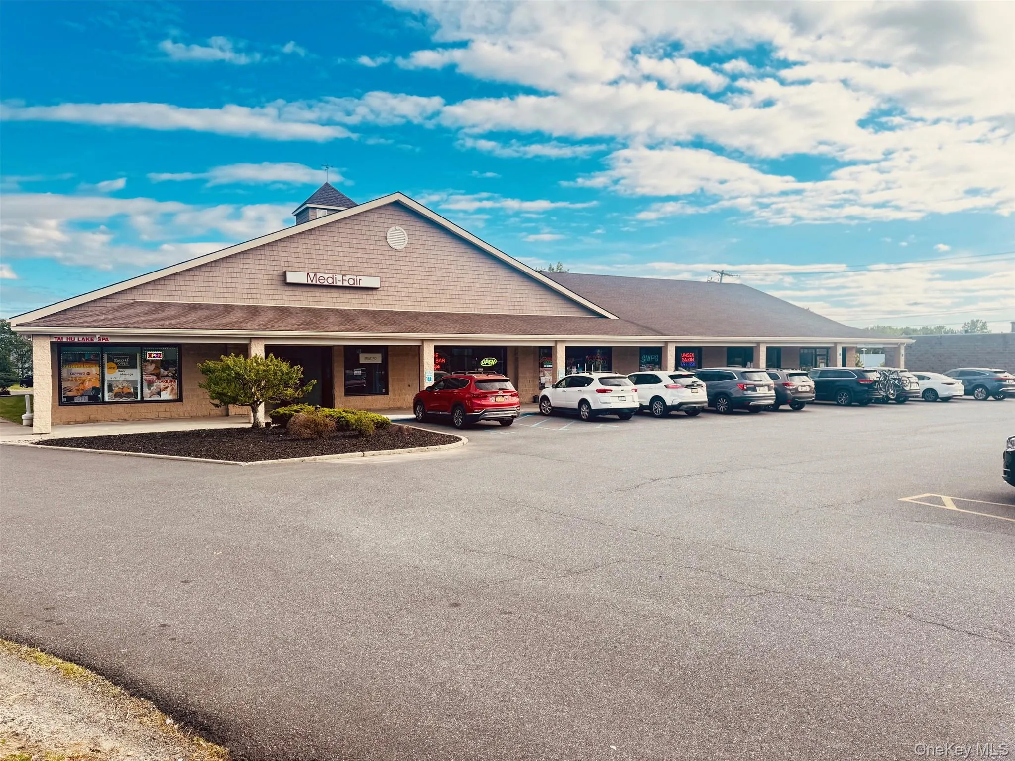 View of property featuring uncovered parking View of property featuring uncovered parking