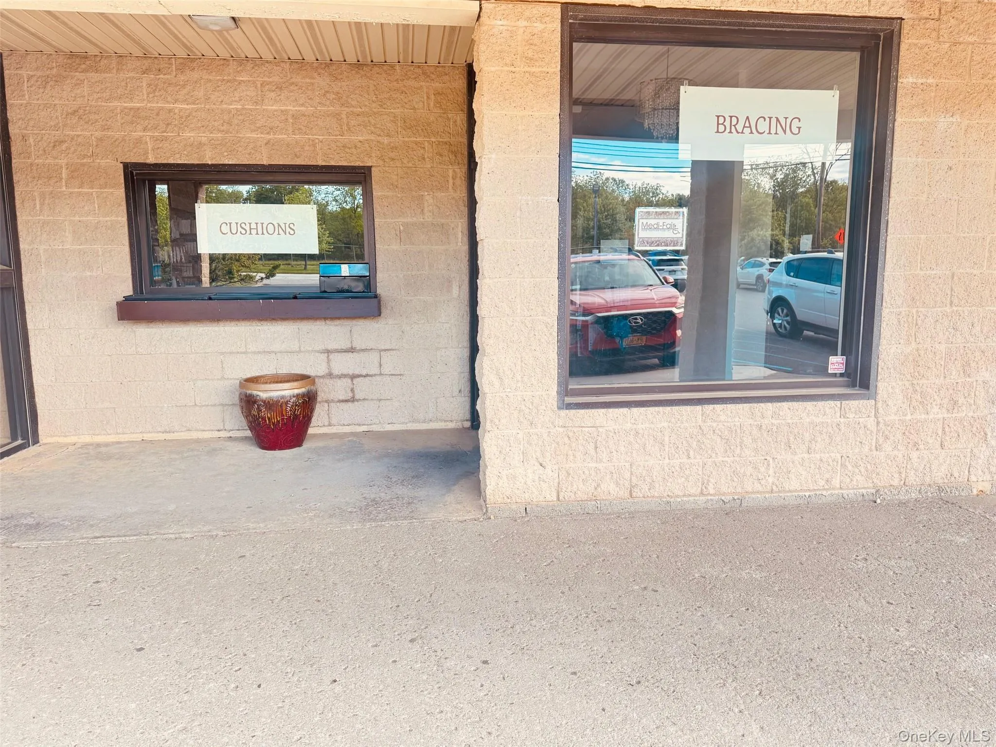 View of exterior entry featuring concrete block siding View of exterior entry featuring concrete block siding