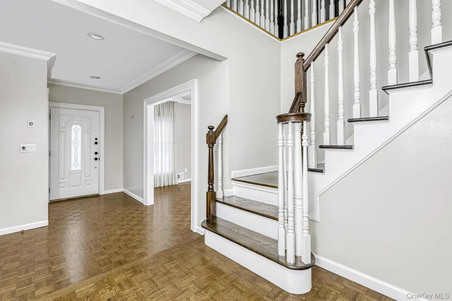 Entryway with baseboards, ornamental molding, stairway, and recessed lighting Entryway with baseboards, ornamental molding, stairway, and recessed lighting