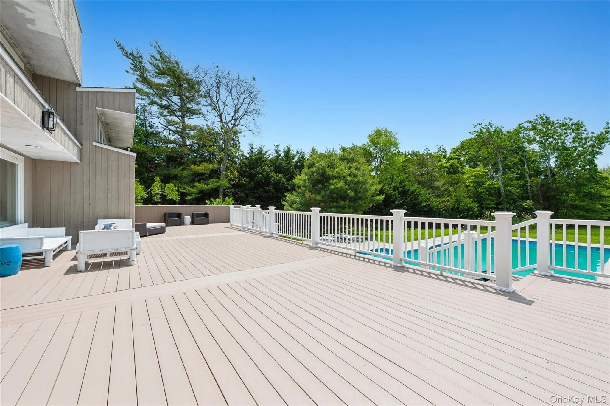 Deck featuring an outdoor hangout area and view of scattered trees Deck featuring an outdoor hangout area and view of scattered trees