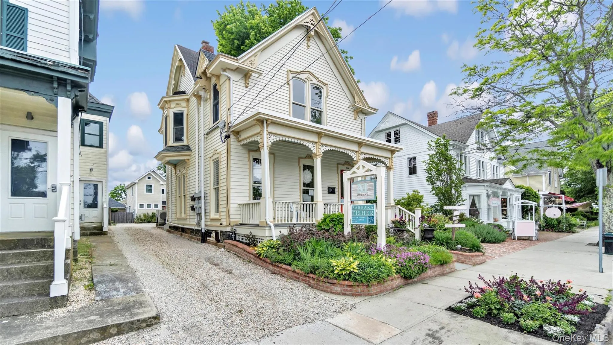 Victorian home with covered porch and concrete driveway Victorian home with covered porch and concrete driveway