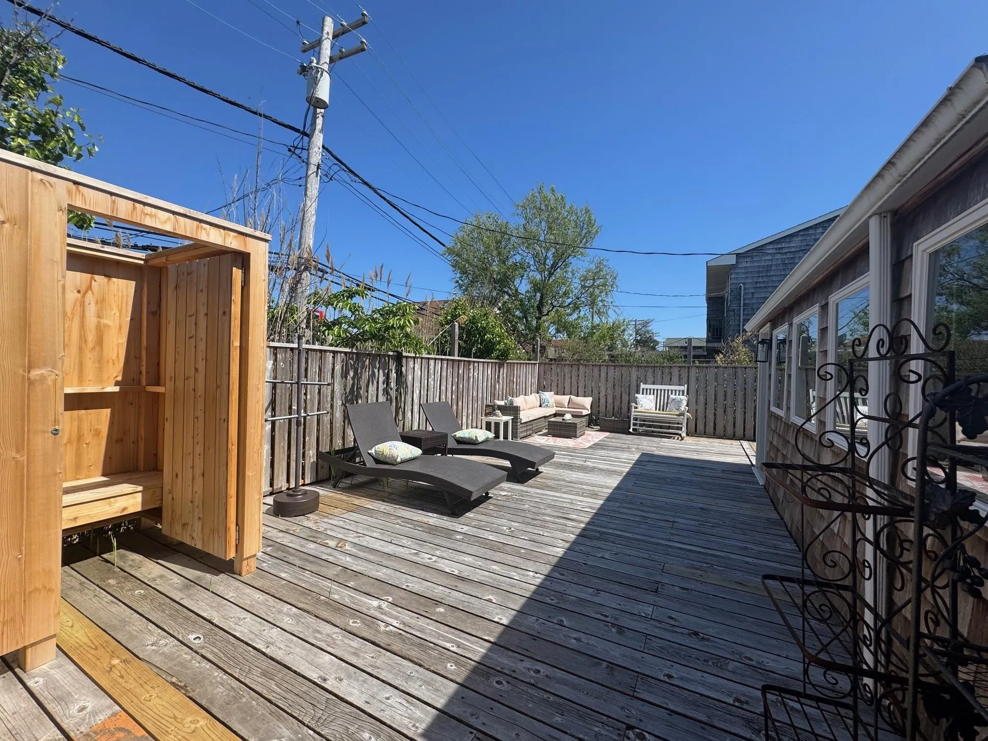 Wooden terrace featuring an outdoor living space Wooden terrace featuring an outdoor living space