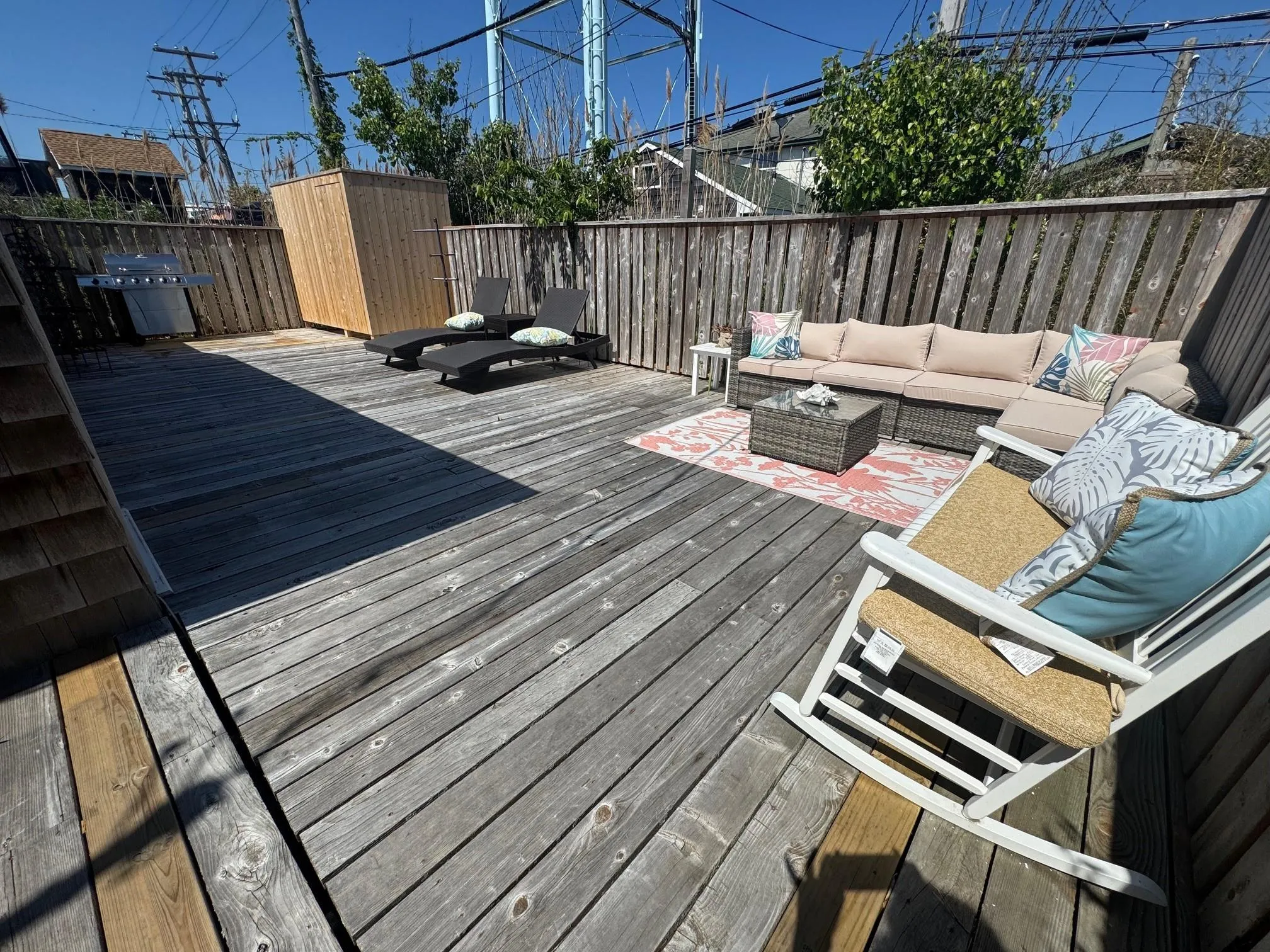 Wooden deck with outdoor lounge area, area for grilling, and a fenced backyard Wooden deck with outdoor lounge area, area for grilling, and a fenced backyard