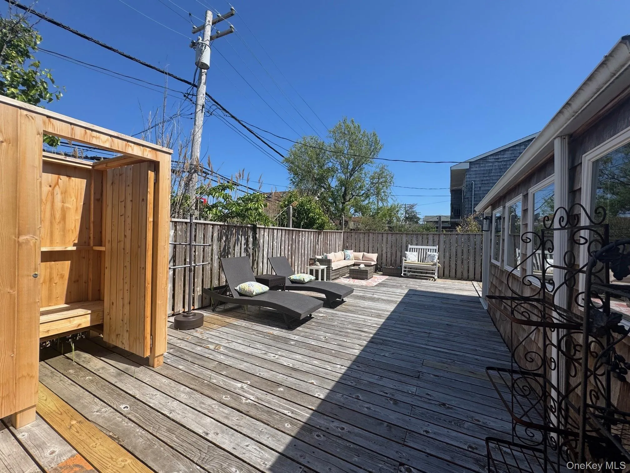 Wooden terrace featuring an outdoor living space Wooden terrace featuring an outdoor living space