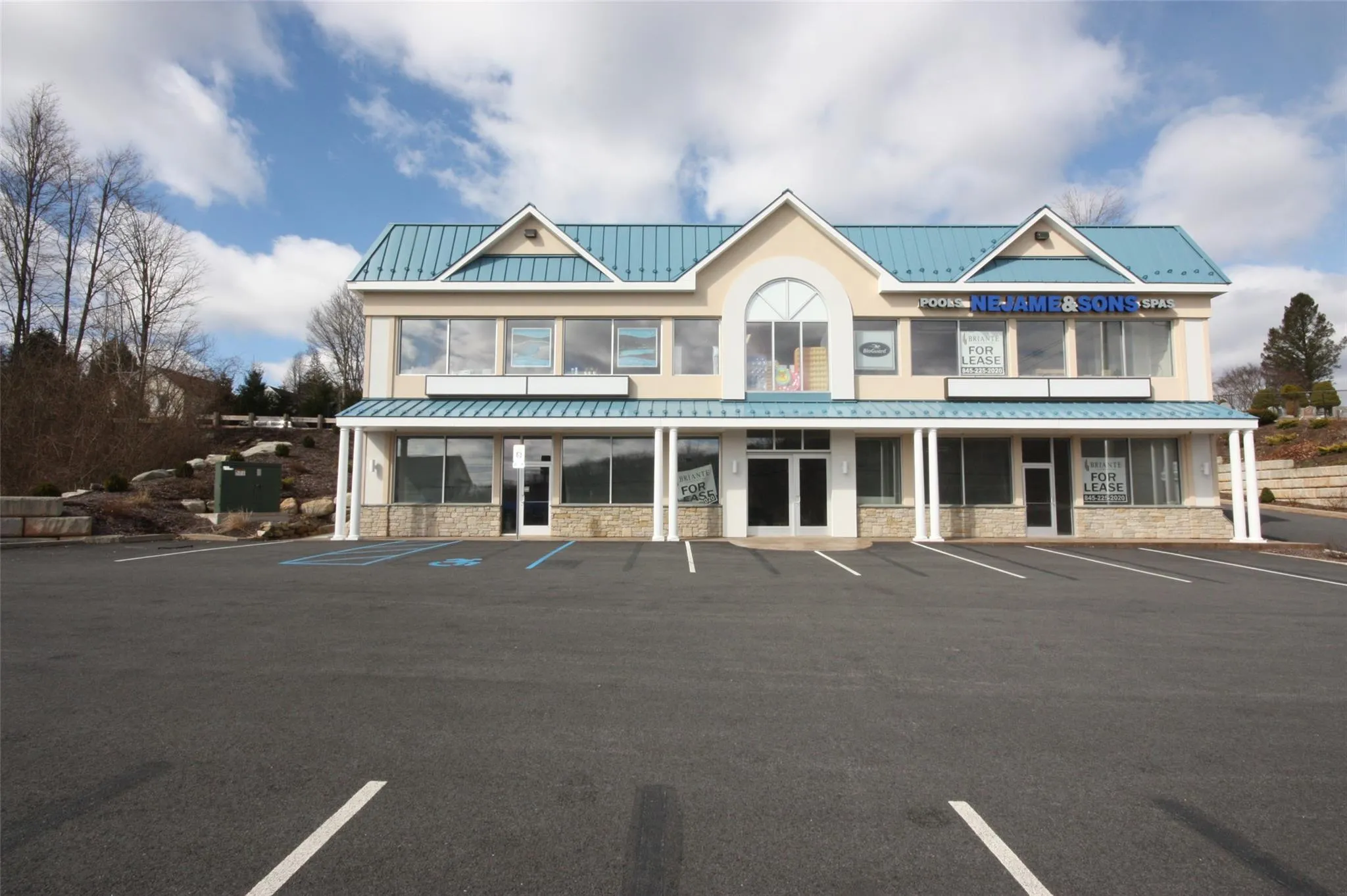 View of property featuring uncovered parking View of property featuring uncovered parking