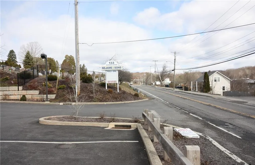 View of asphalt road with street lights View of asphalt road with street lights
