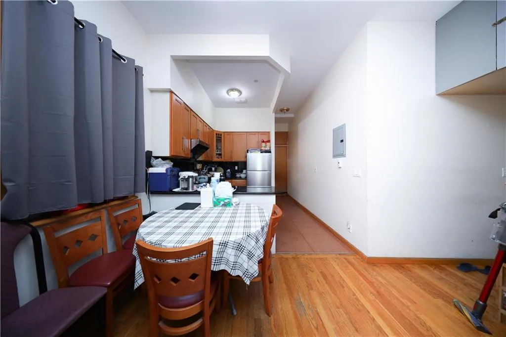 Dining area featuring electric panel, baseboards, and light wood-style flooring Dining area featuring electric panel, baseboards, and light wood-style flooring