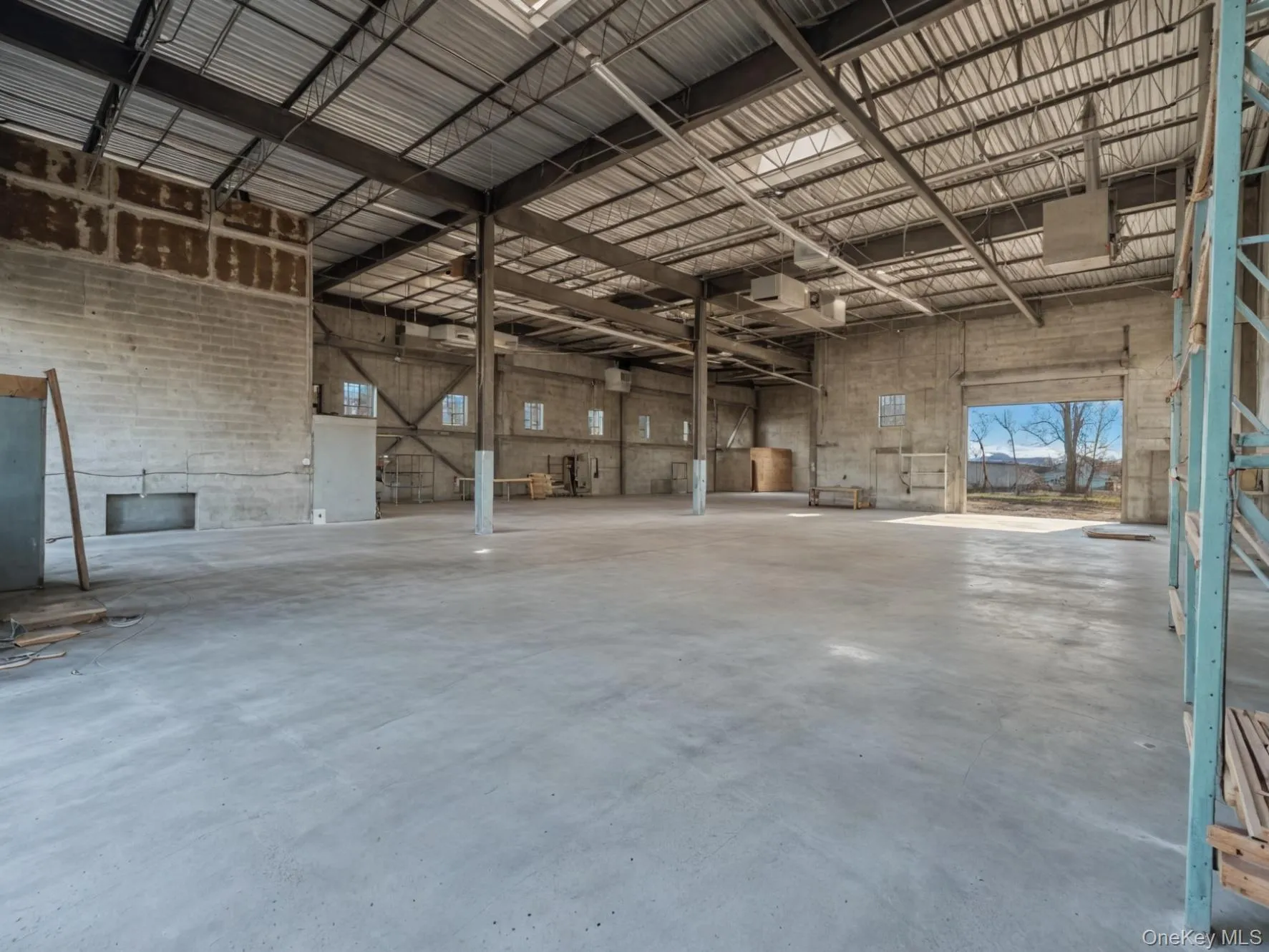 Miscellaneous room with a towering ceiling and a garage Miscellaneous room with a towering ceiling and a garage