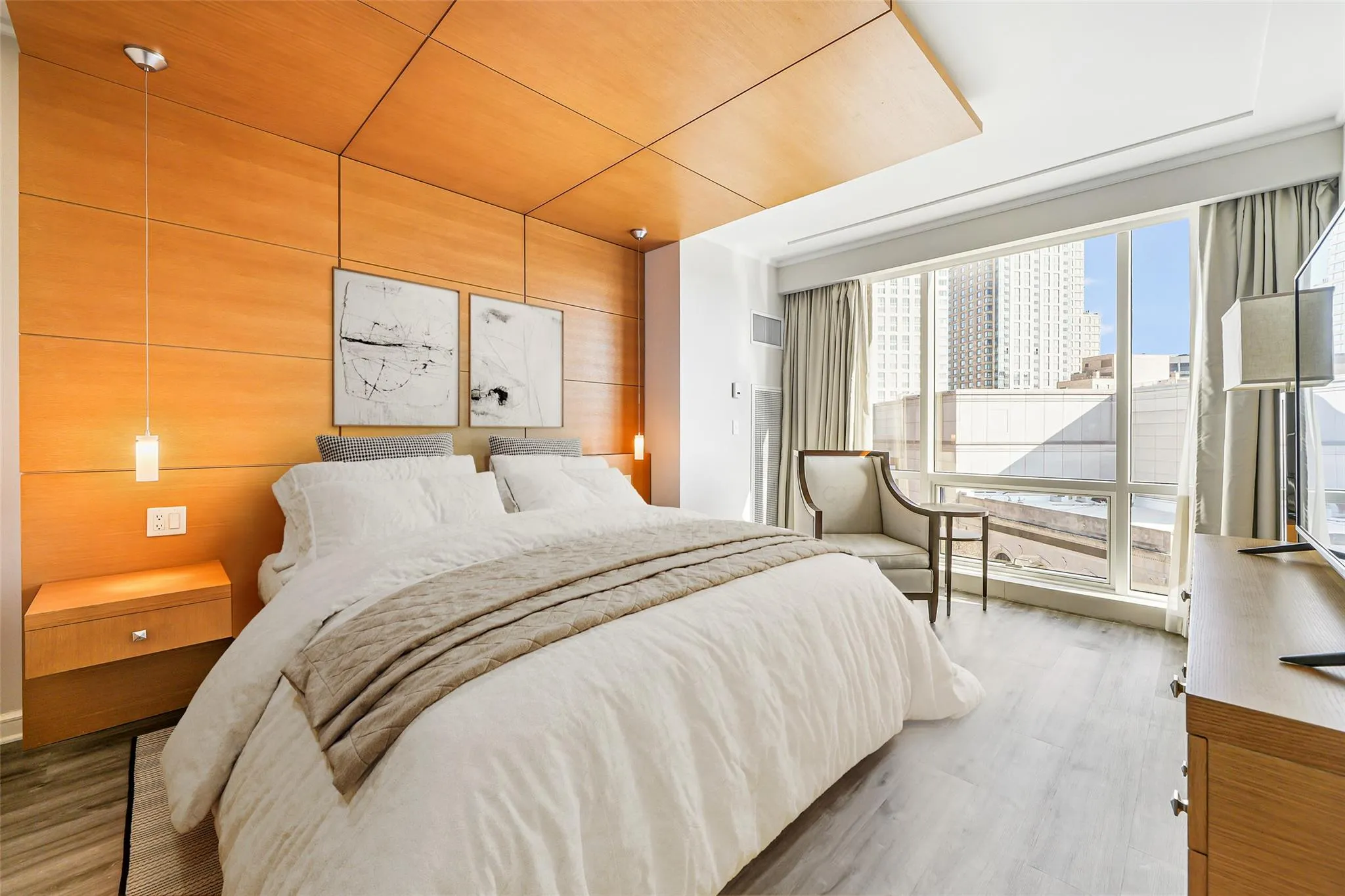 Bedroom featuring wood finished floors and wooden walls Bedroom featuring wood finished floors and wooden walls