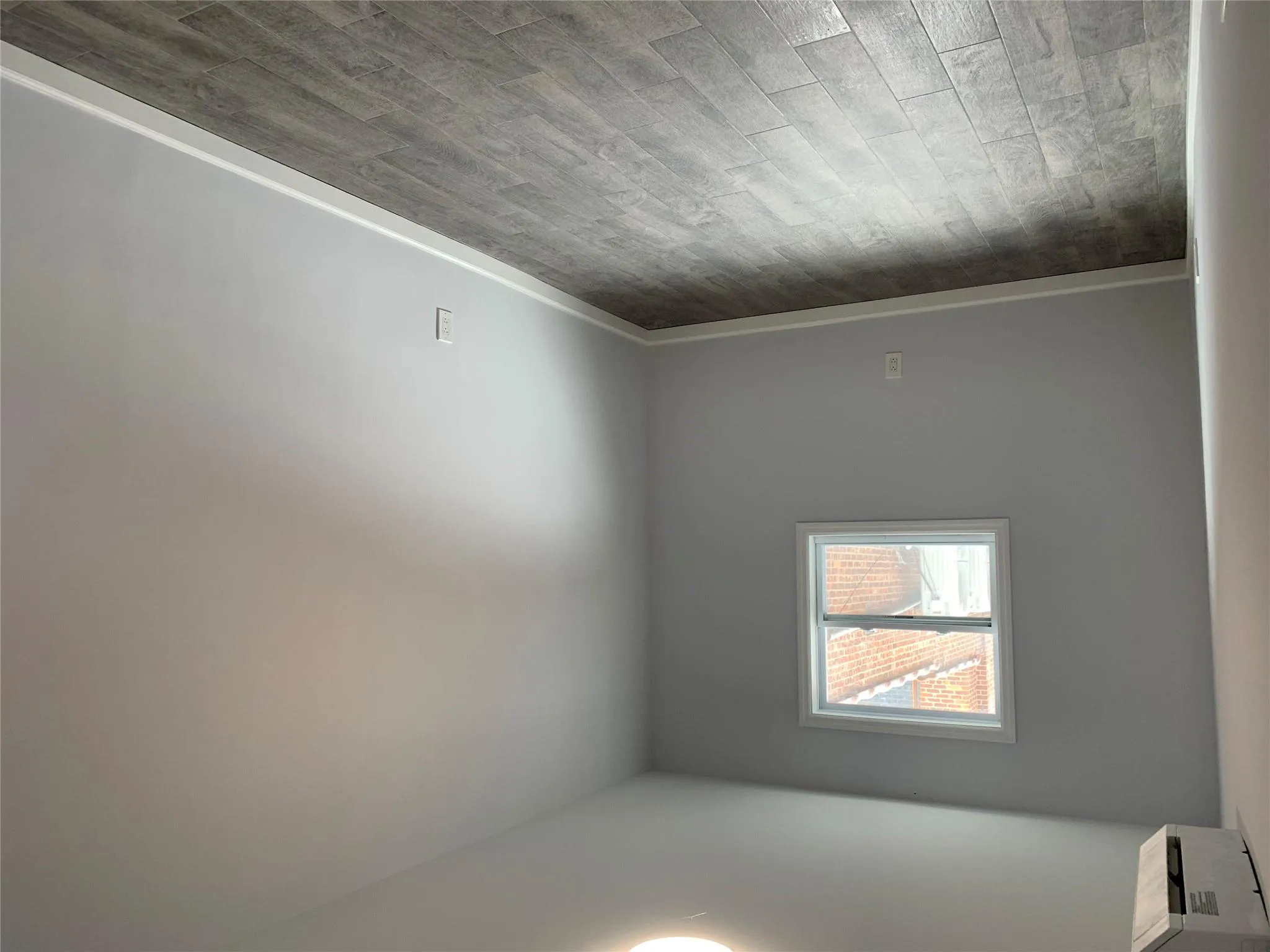 Empty room featuring dark wood finished floors and baseboards Empty room featuring dark wood finished floors and baseboards