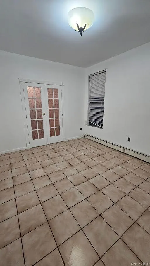 Spare room with french doors. Spare room with french doors.