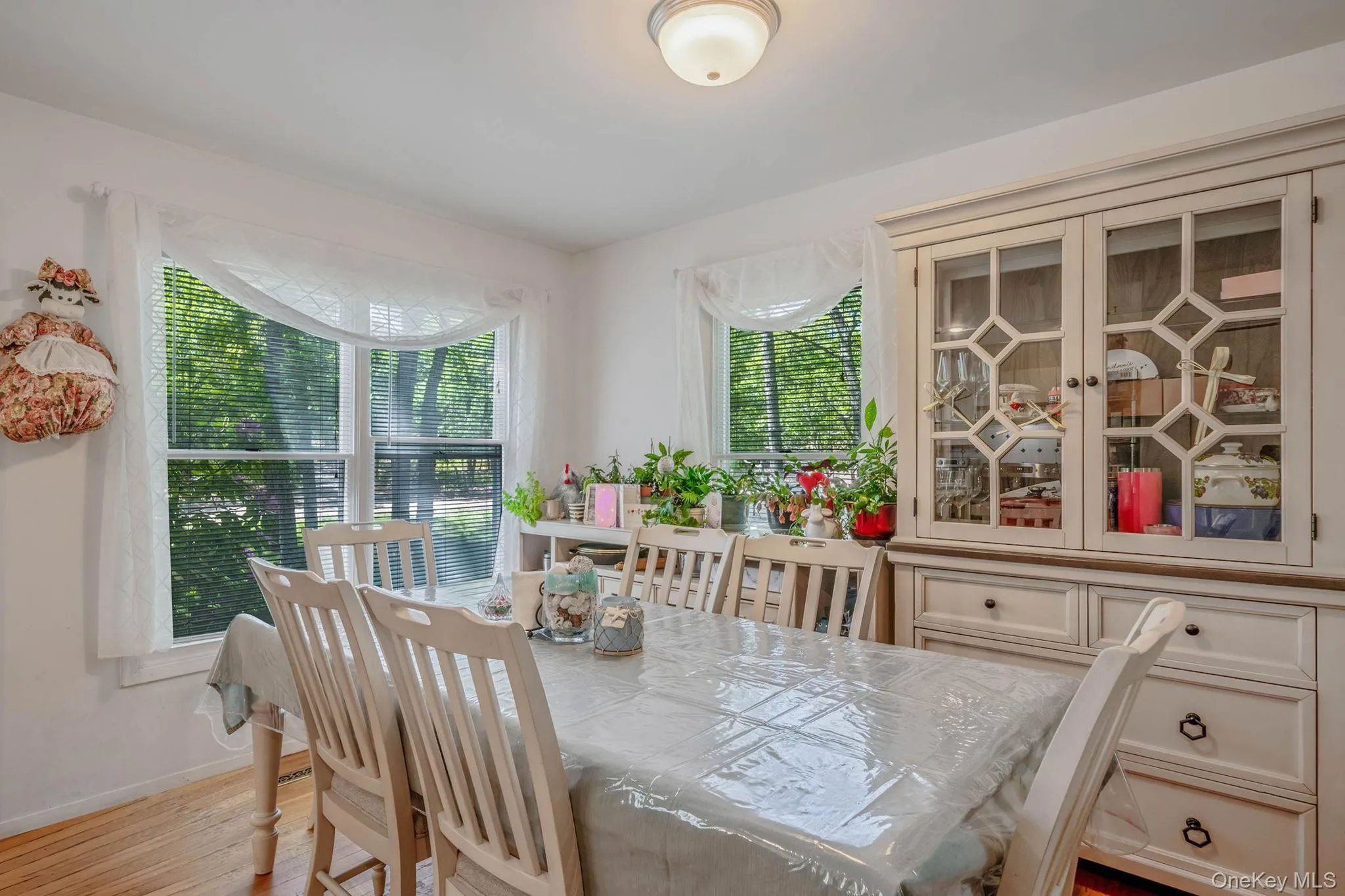 Dining room featuring light wood finished floors and baseboards Dining room featuring light wood finished floors and baseboards