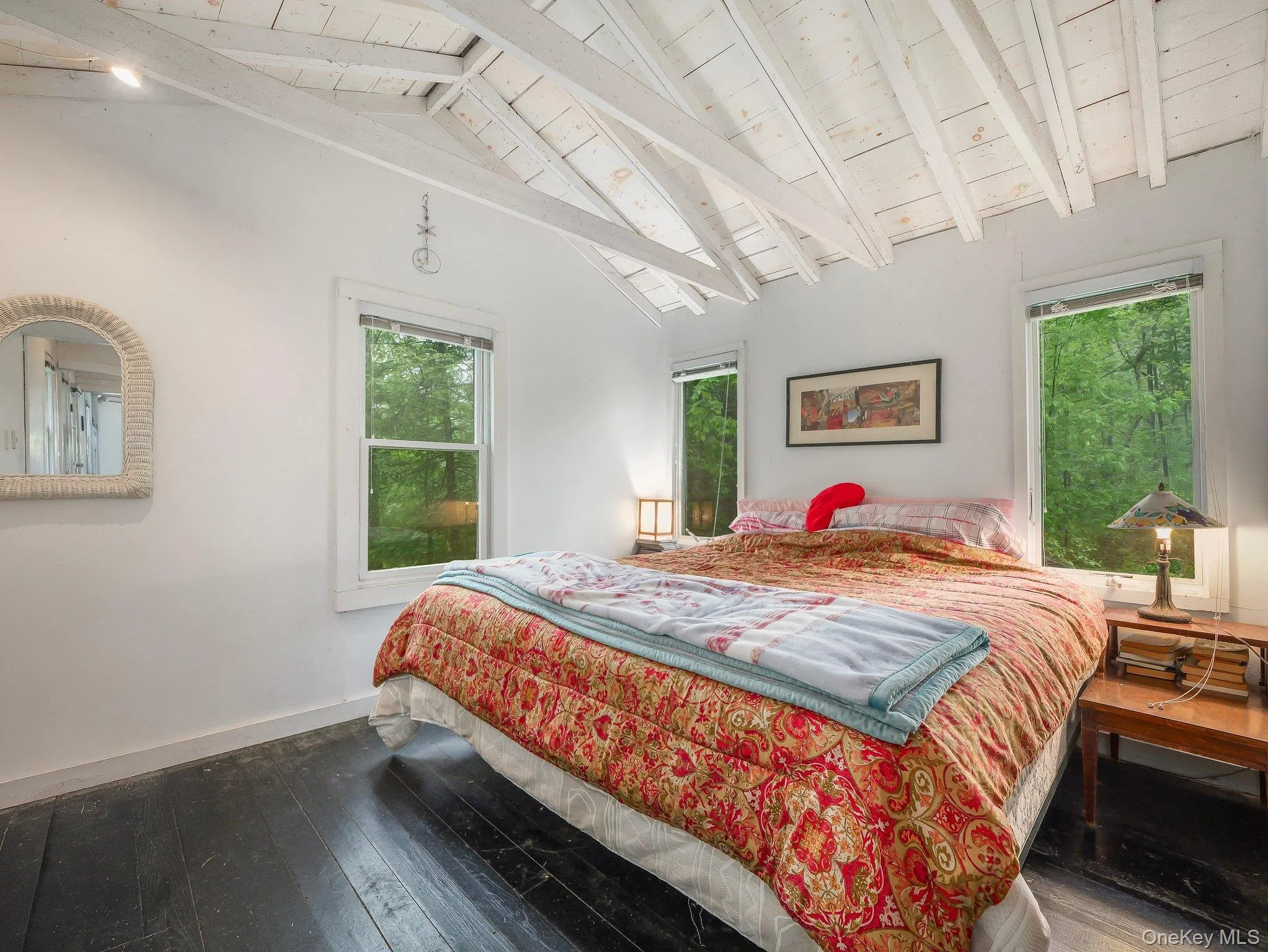 Bedroom with wood-type flooring, wooden ceiling, and baseboards Bedroom with wood-type flooring, wooden ceiling, and baseboards