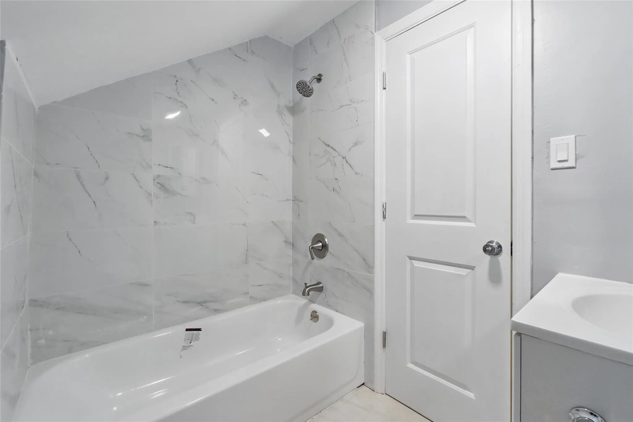 Bathroom featuring shower / bath combination and vanity Bathroom featuring shower / bath combination and vanity