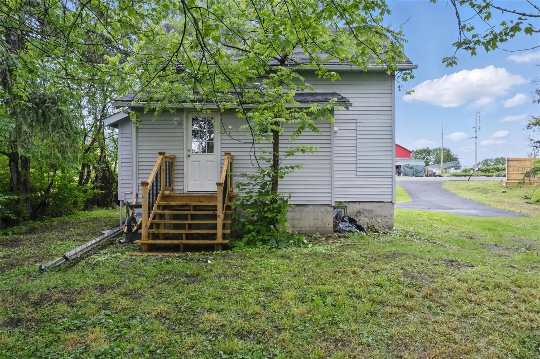 Back of house featuring a yard Back of house featuring a yard
