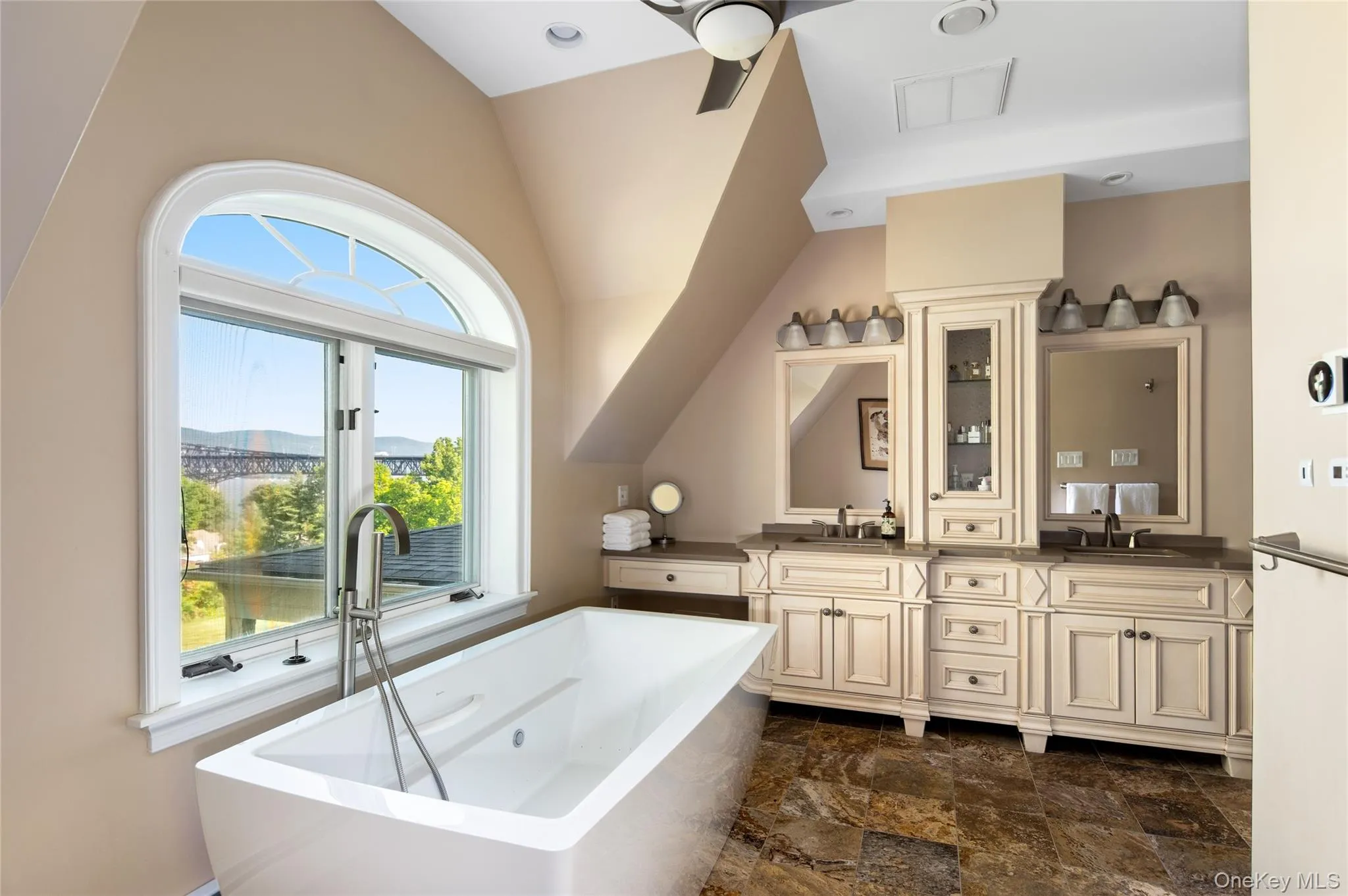 Double vanity, quartz counters, soaking tub with river view. Double vanity, quartz counters, soaking tub with river view.