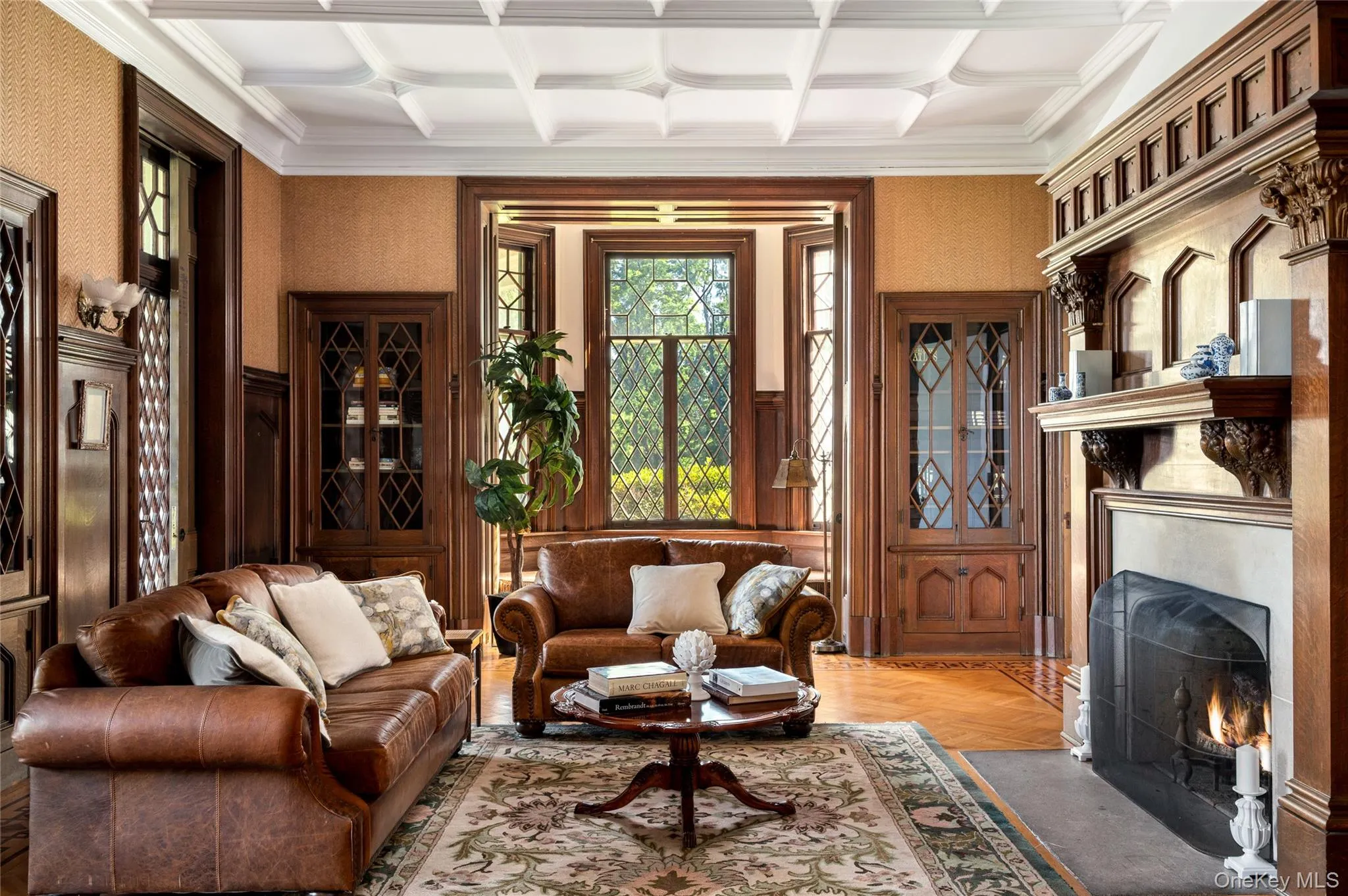Built-ins, mullioned bay windows, fireplace, diamond-patterned glass doors, veranda access, inlaid and parquet floors, tracery ceiling. Built-ins, mullioned bay windows, fireplace, diamond-patterned glass doors, veranda access, inlaid and parquet floors, tracery ceiling.