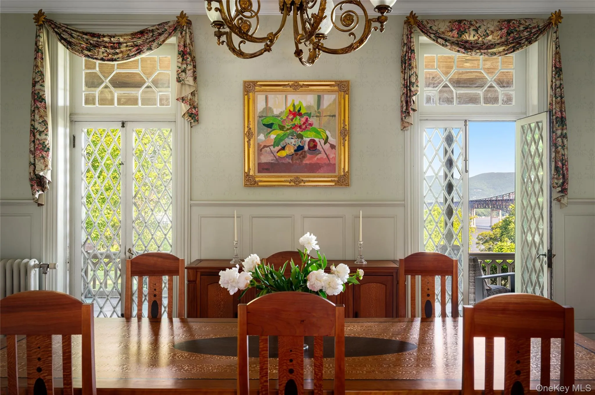 Floor-to-ceiling wood-framed diamond-patterned glass doors with veranda access, hand-painted walls. Floor-to-ceiling wood-framed diamond-patterned glass doors with veranda access, hand-painted walls.