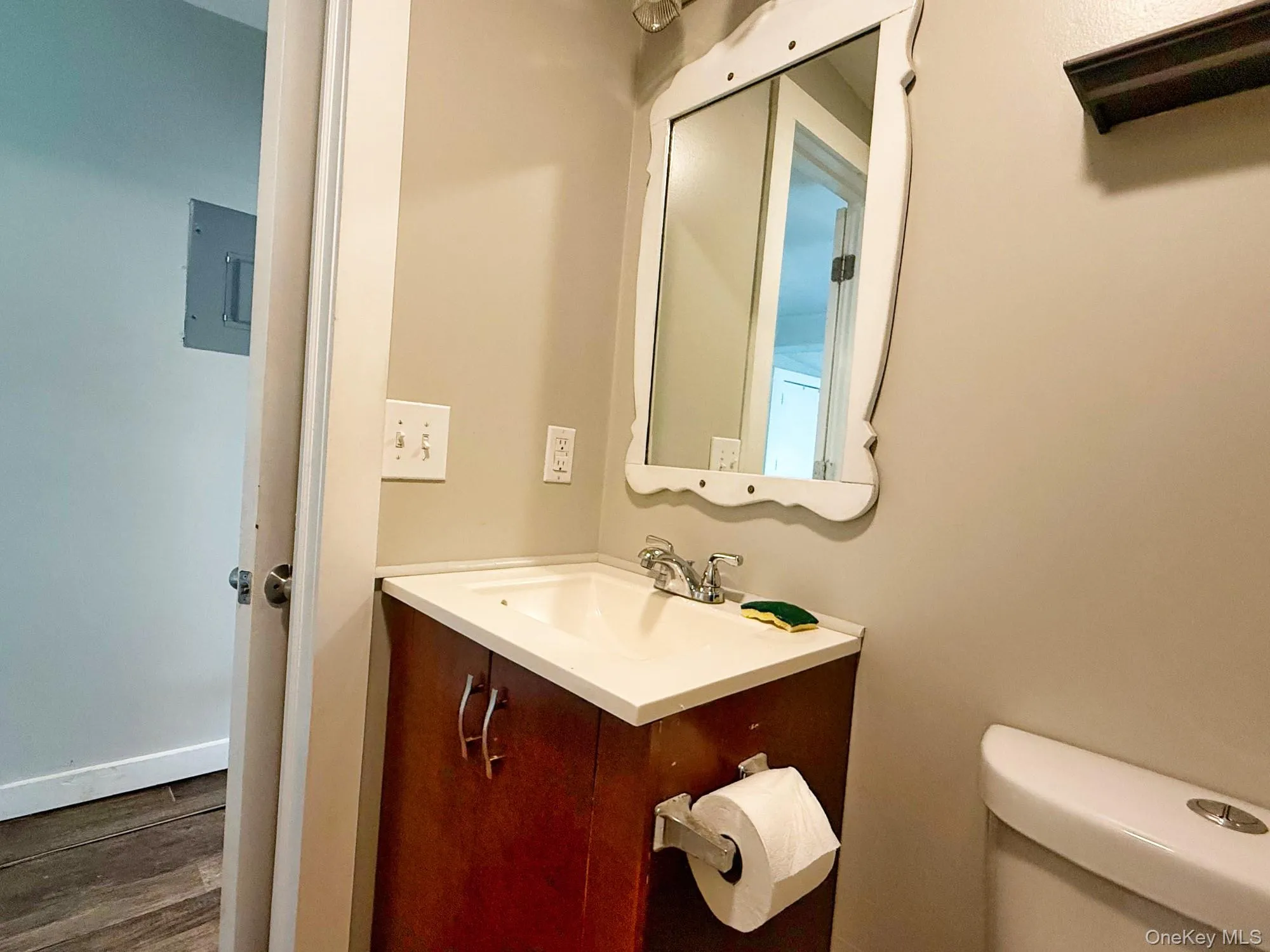 Bathroom with vanity and wood finished floors Bathroom with vanity and wood finished floors